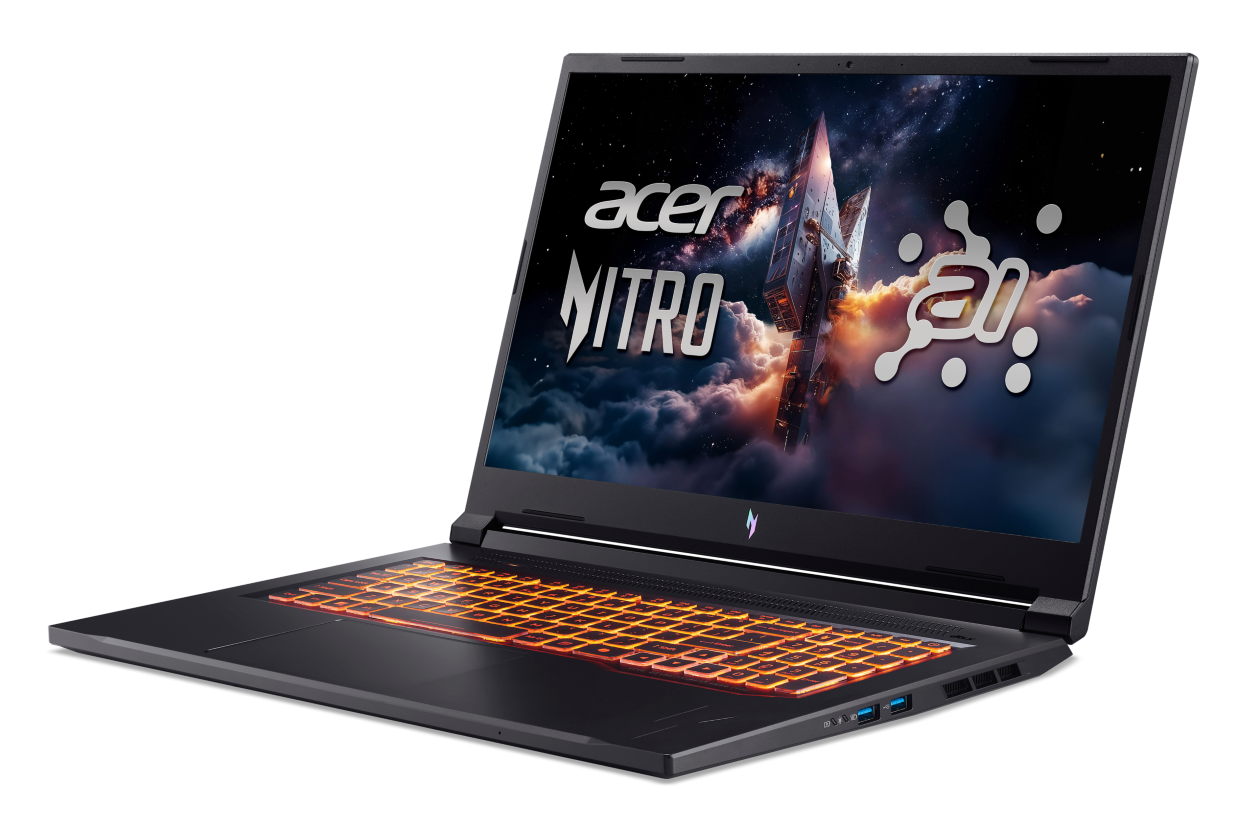 Czarny laptop z podświetlaną klawiaturą i sceną kosmiczną na ekranie.