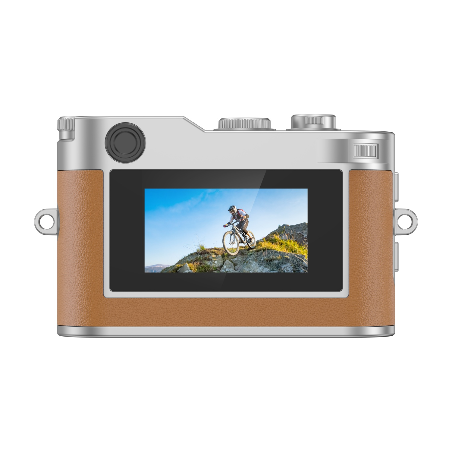 Fotocamera in pelle marrone e metallo argento, mostra mountain biker su rocce.
