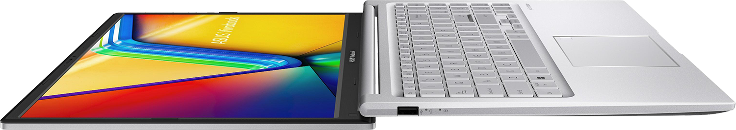 Egy nyitott ezüst laptop színes háttérképpel a képernyőn.