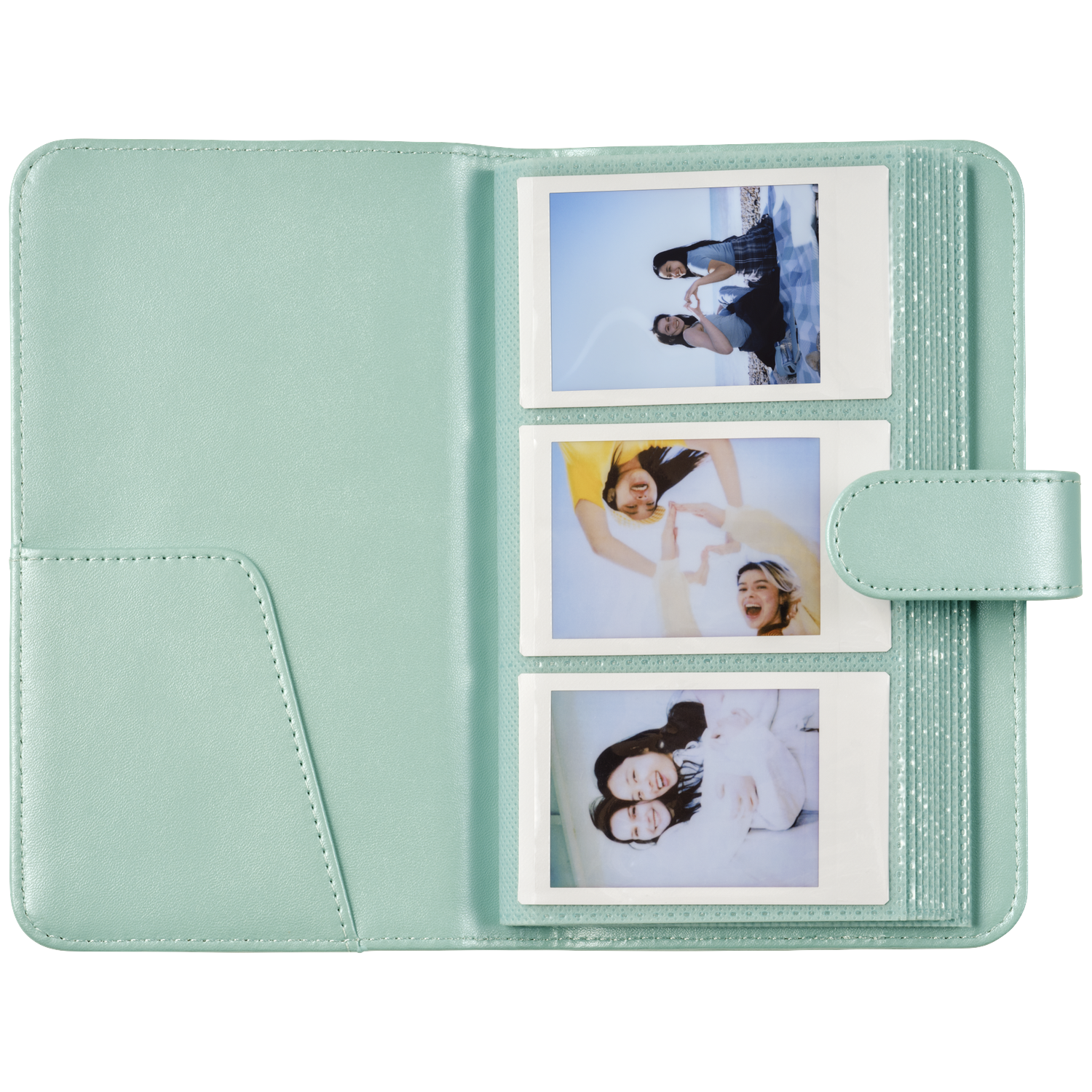 A mint green photo album holding three instant photos of young women.