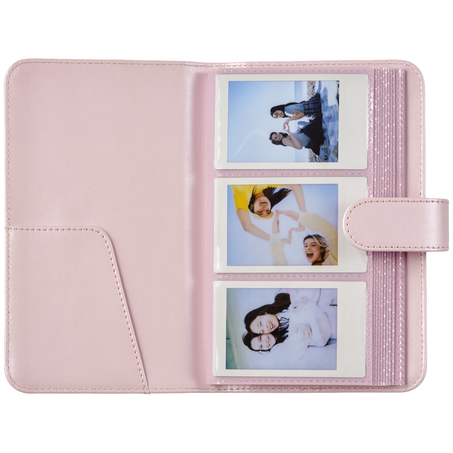 A pink photo album displaying three instant photos of young women.