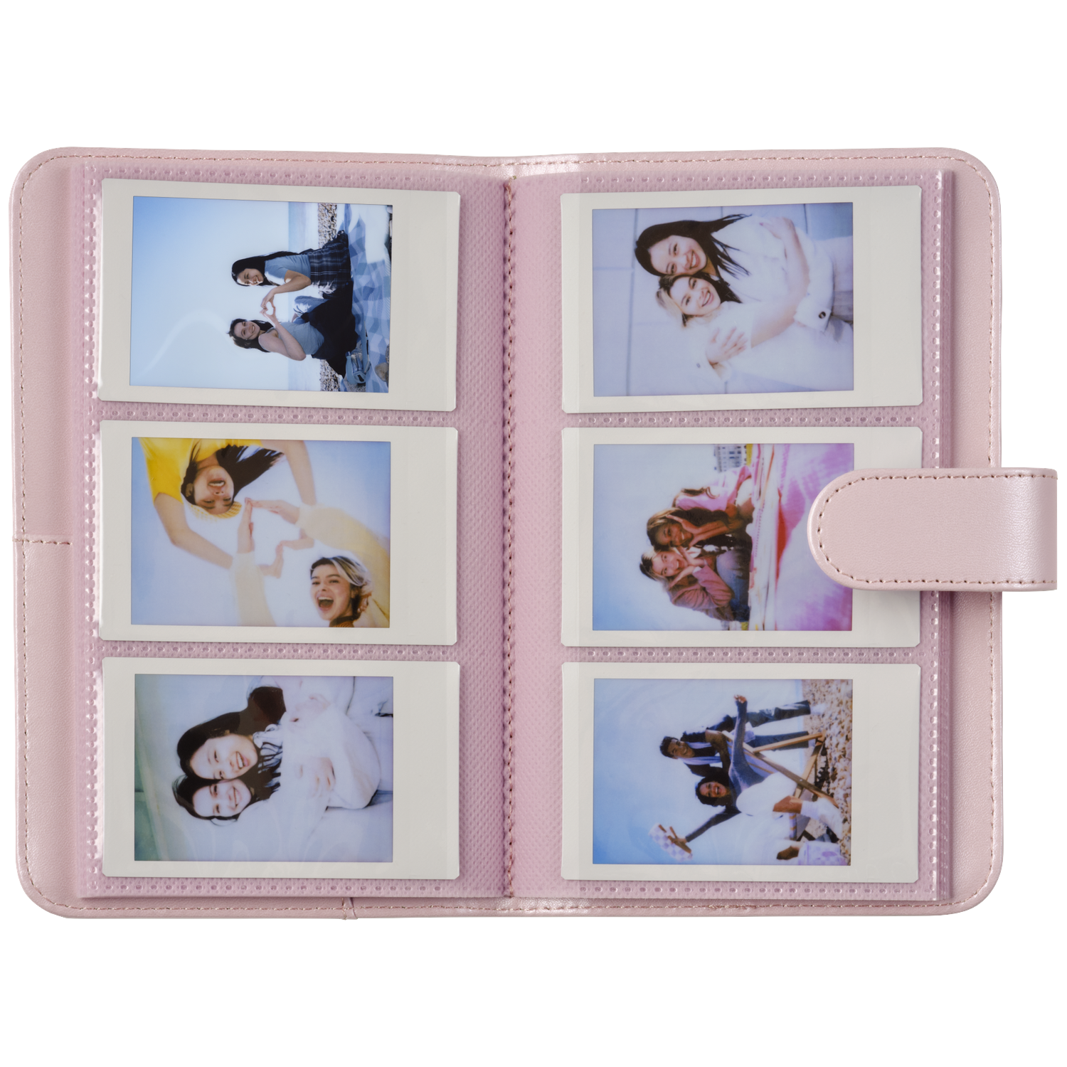 A pink photo album holding six instant photos of young women.