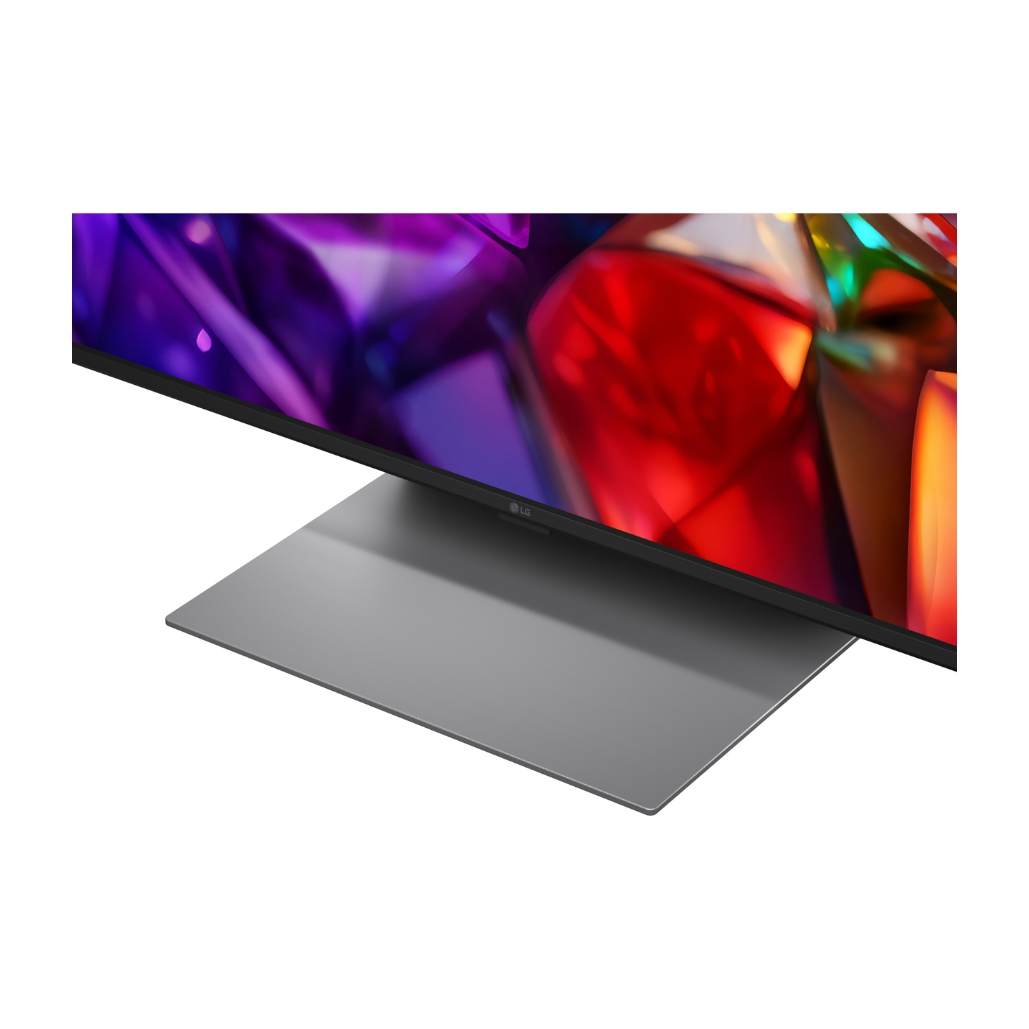 Un televisore LG con sfondo astratto colorato su un supporto grigio.
