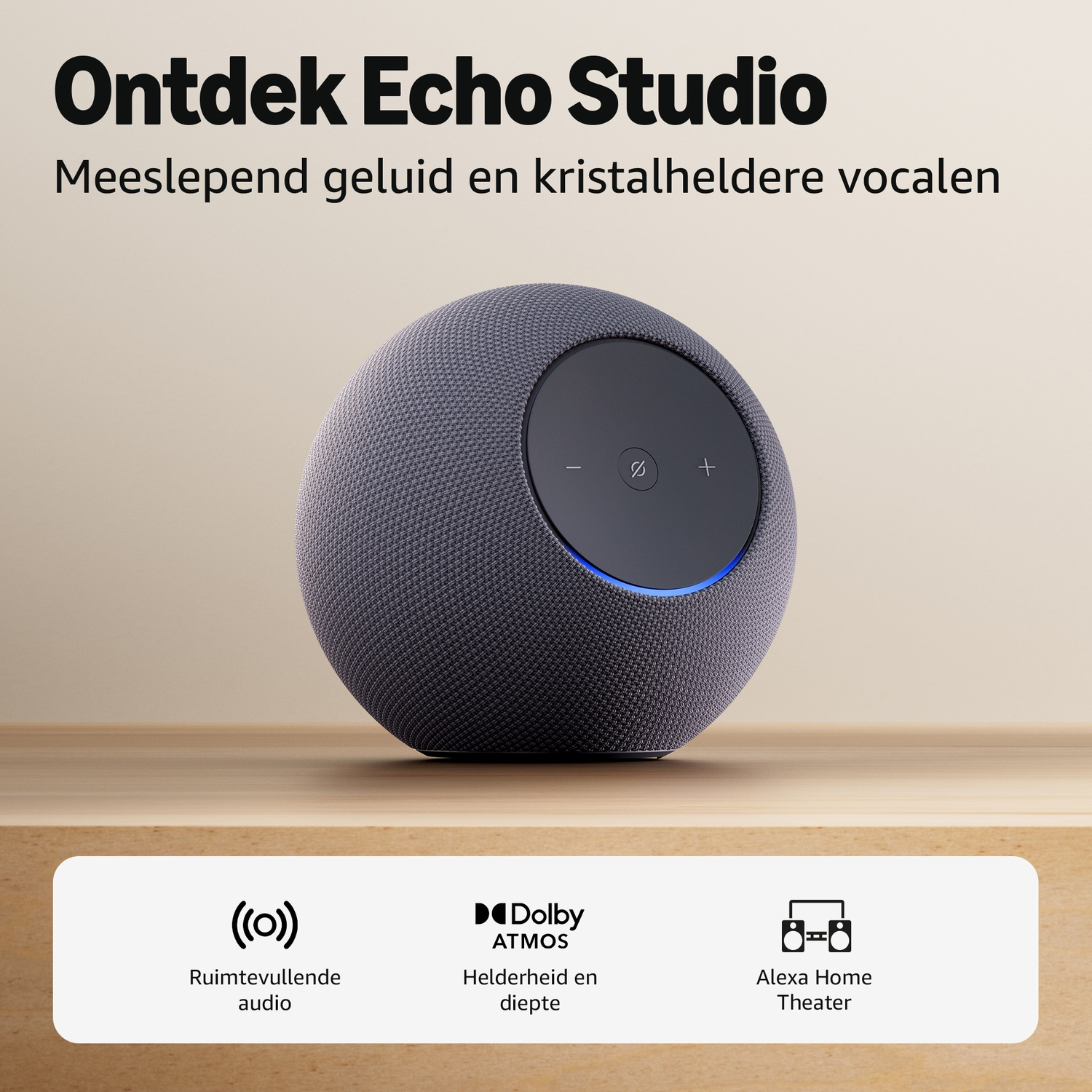 Gray Echo Studio speaker with controls on a wooden table. Immersive audio.