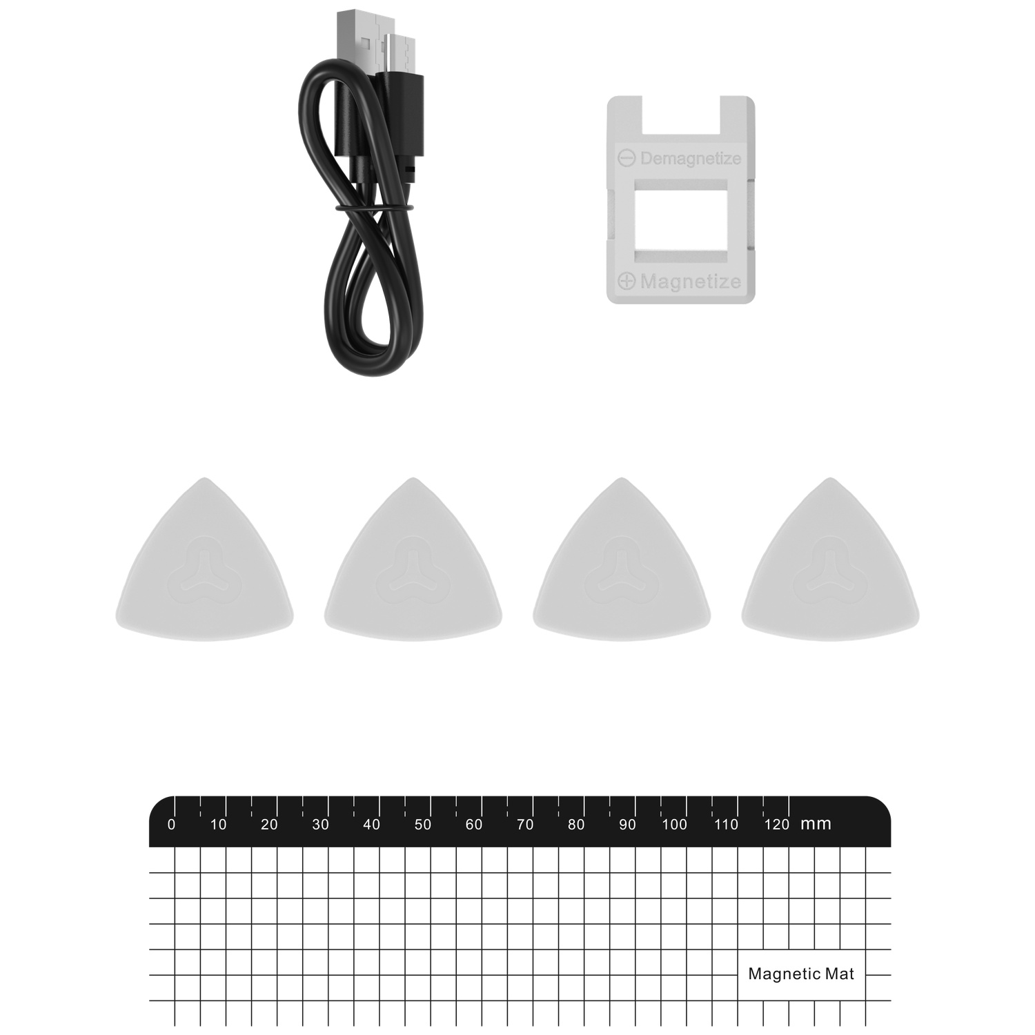 Un câble USB noir, un outil de magnétisation/démagnétisation et quatre triangles sur un tapis magnétique.