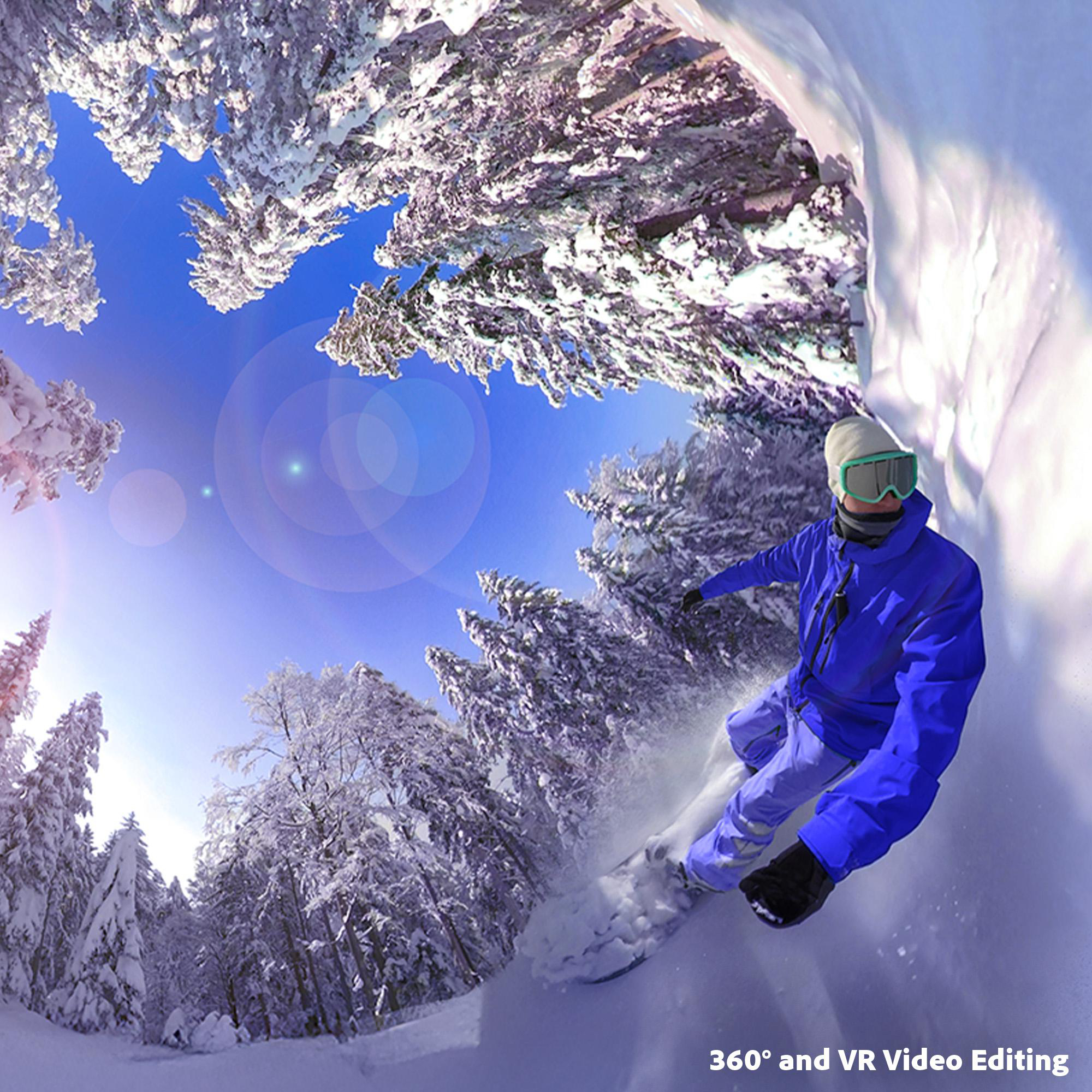Ein Snowboarder in blauer Kleidung fährt durch einen verschneiten Wald.