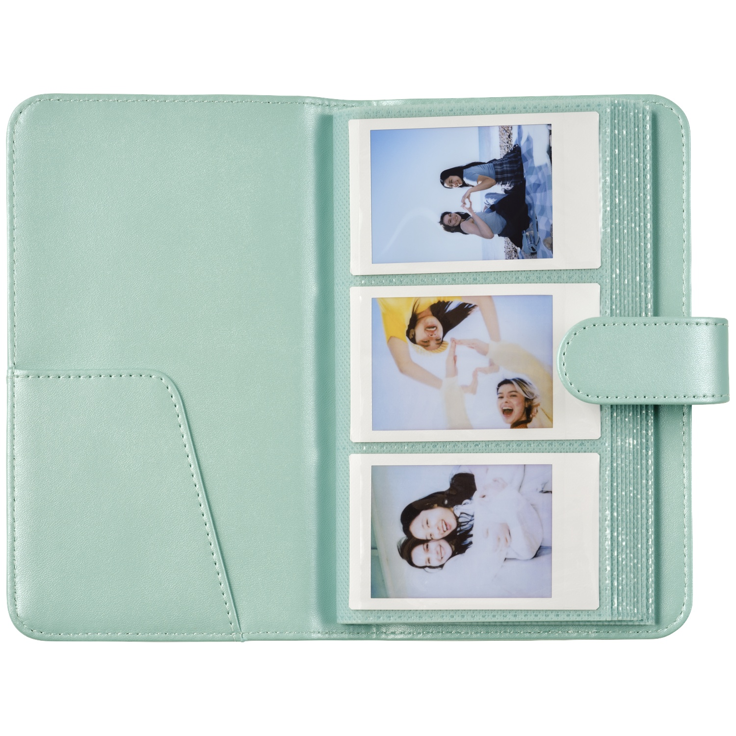 A light green photo album holding three photos of young women smiling.