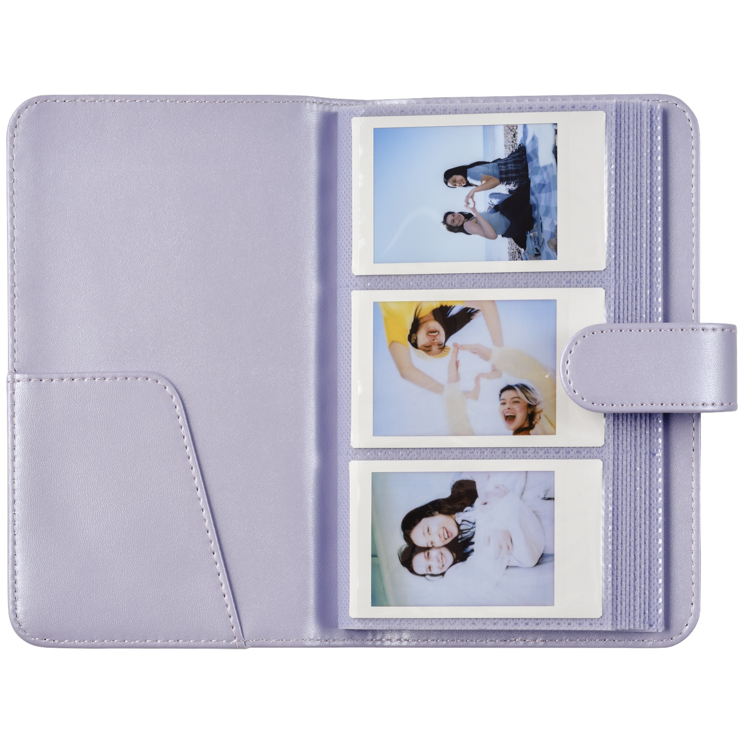 Purple photo album with three instant photos of smiling young women.