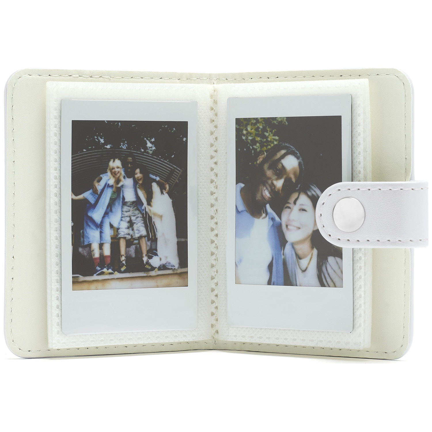 A white photo album with two instant photos: three people on the left, a couple on the right.