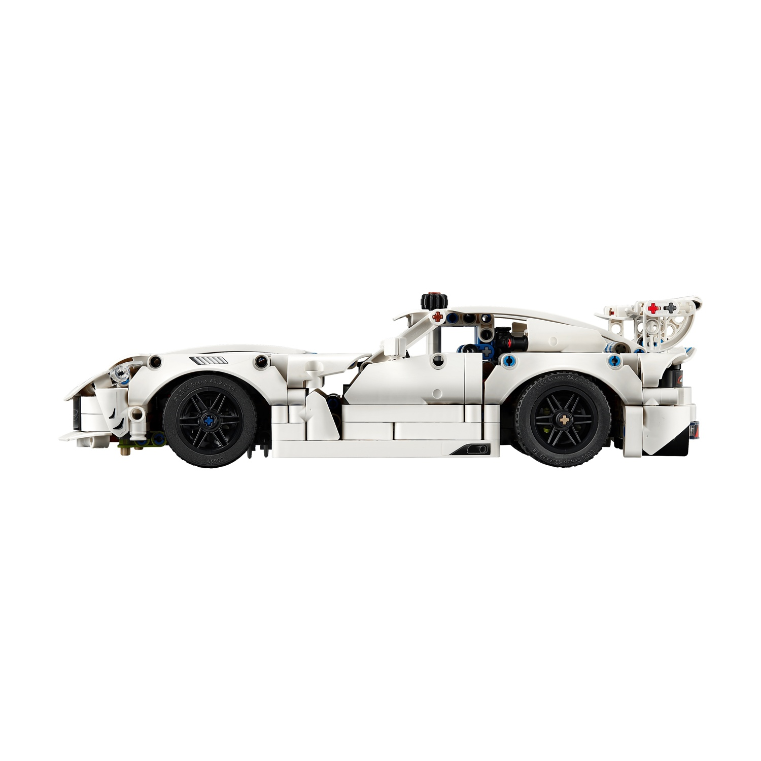 Auto da corsa Lego bianca con spoiler e ruote nere, vista laterale.