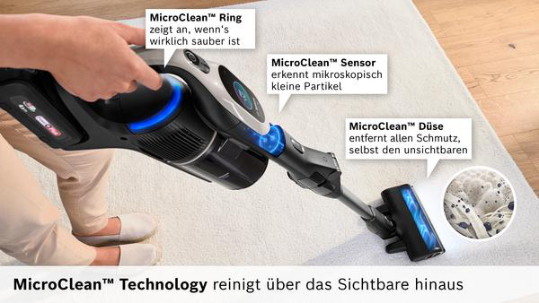 Ein Handstaubsauger mit MicroClean-Technologie reinigt einen Teppich. Zeigt Ring, Sensor und Düse.