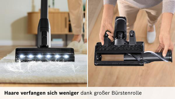 Staubsaugerbürste mit LED-Licht auf Teppich und Händen, die sie halten.