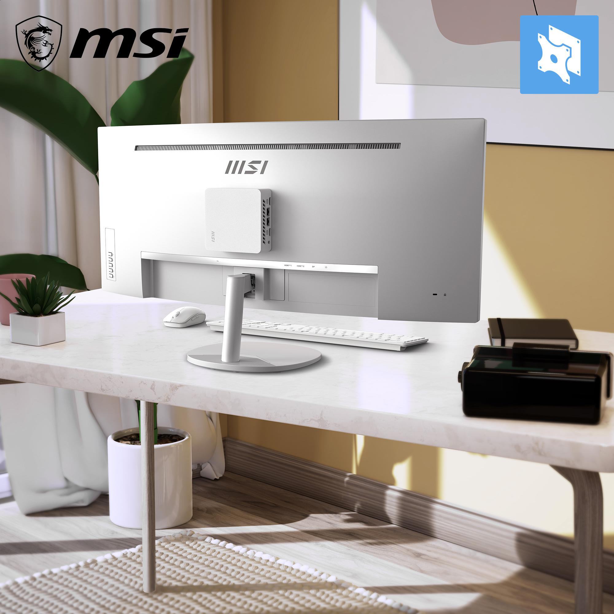 MSI Monitor auf einem Schreibtisch mit Tastatur, Maus, Pflanze und Büchern. Weißer Schreibtisch.
