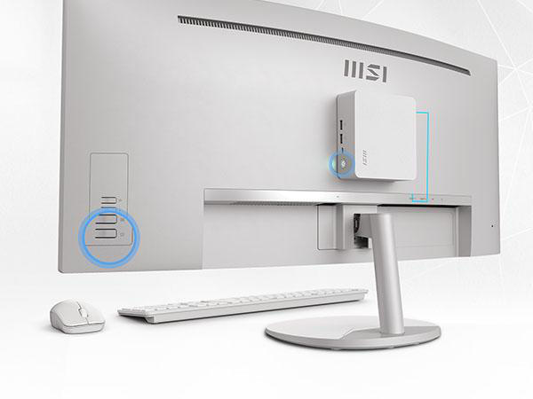 Rückseite eines weißen All-in-One-Computers mit Maus und Tastatur.