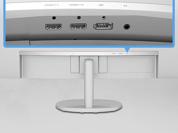 Nahaufnahme der Rückseite eines Monitors, die verschiedene Anschlüsse zeigt: zwei HDMI, einen DisplayPort und eine Audiobuchse.