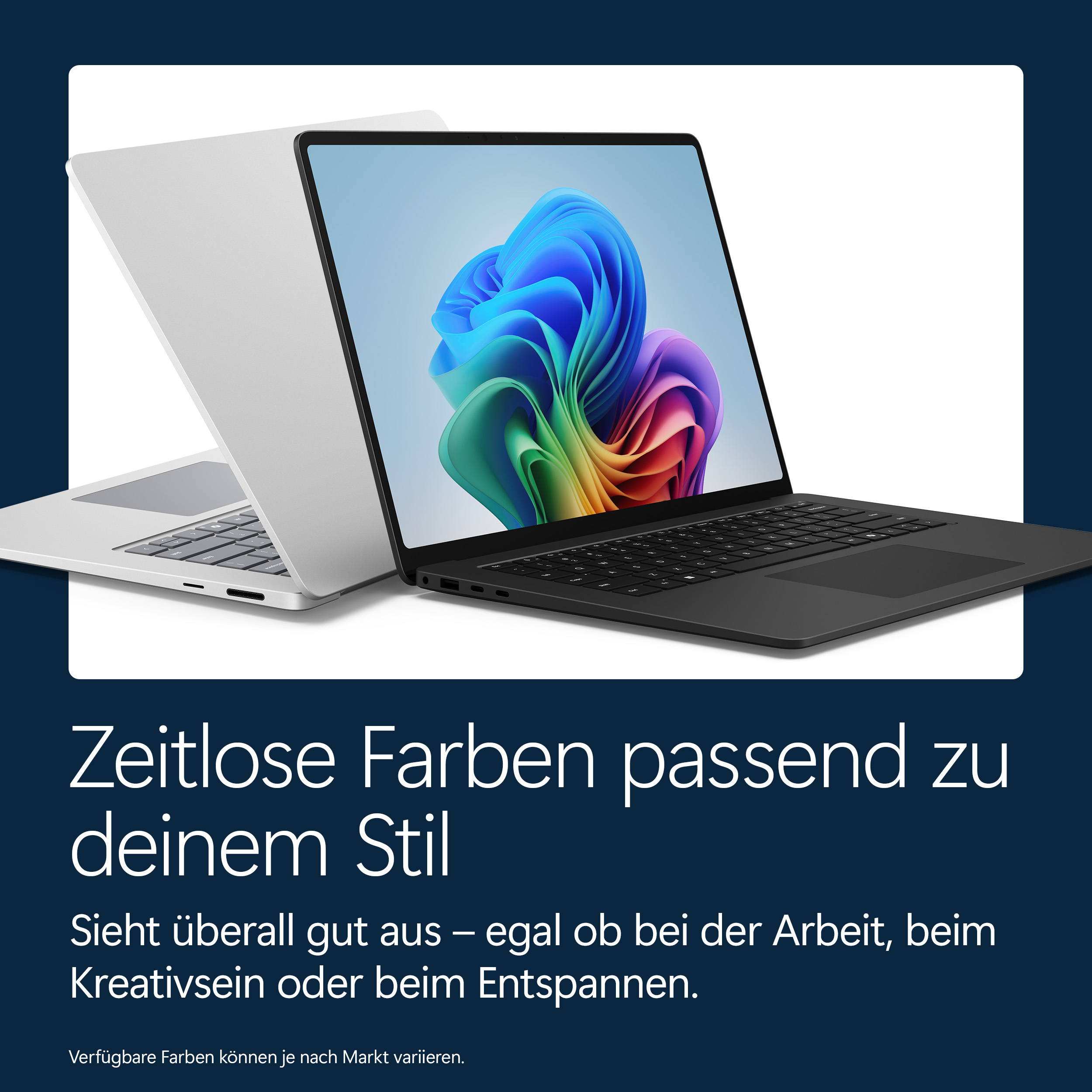 Ein silberner und ein schwarzer Laptop nebeneinander. Der schwarze Laptop zeigt ein buntes Desktop-Hintergrundbild.