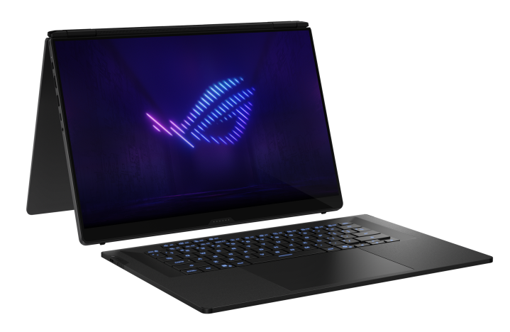 Ciemny laptop z podświetlaną klawiaturą i neonowym logo na ekranie.