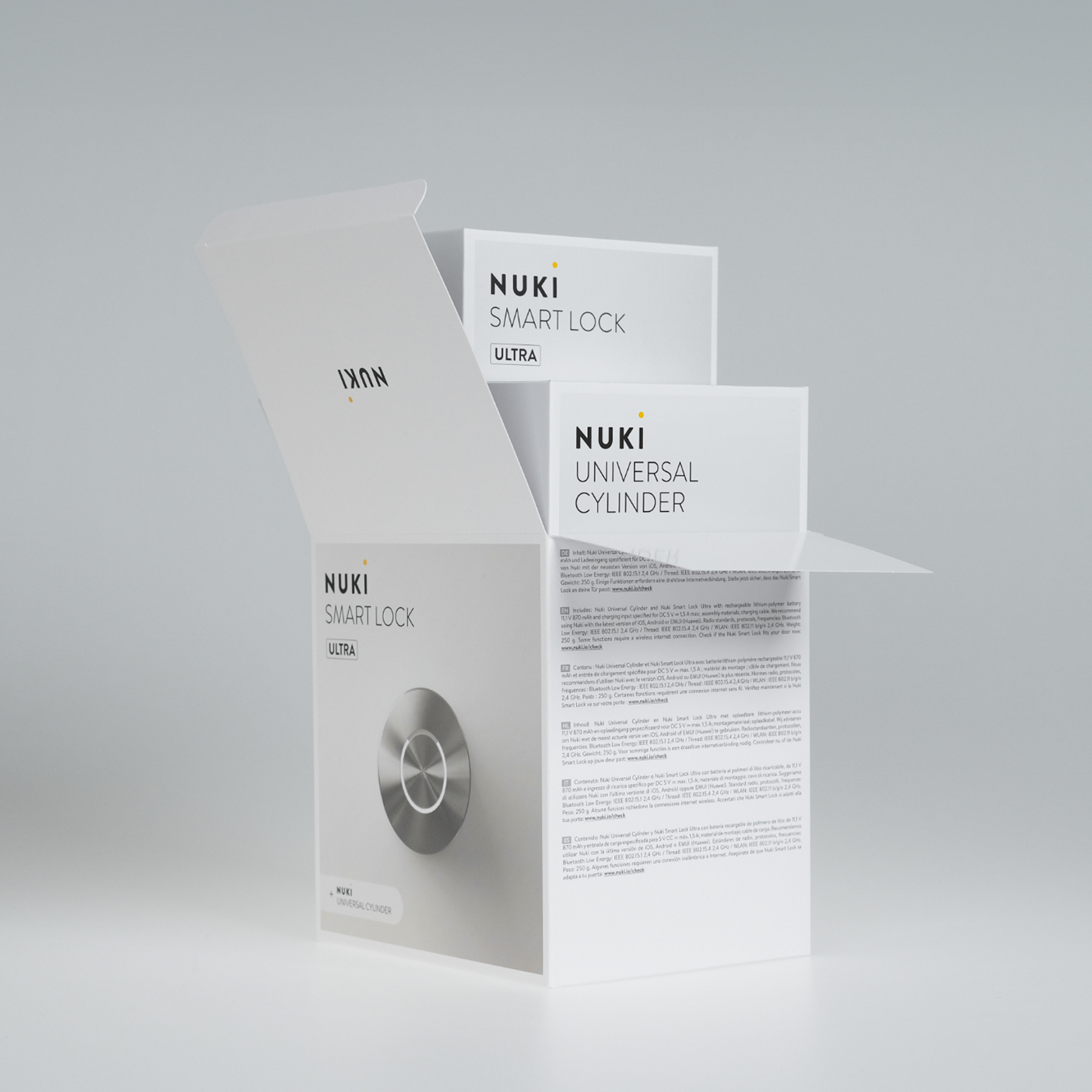 Nuki Smart Lock és Universal Cylinder csomagolás, fehér, szöveggel és képpel.