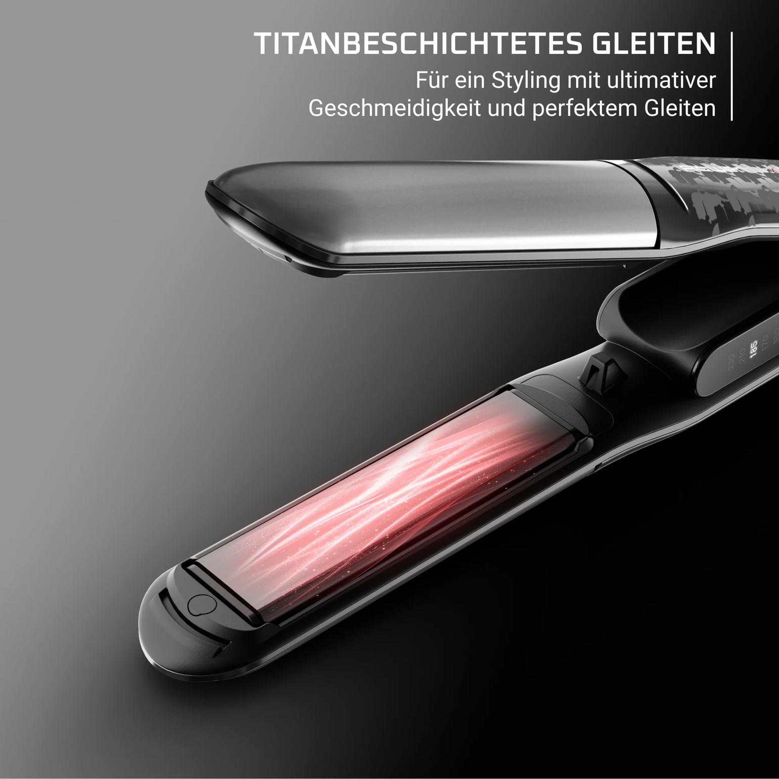 Ein offener Haarglätter mit erhitzten, roten Heizelementen und digitaler Temperaturanzeige.