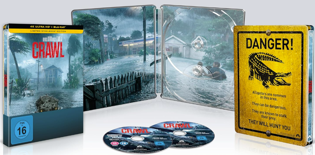 Ein Blu-ray-Steelbook mit 'Crawl'. Die Hülle zeigt eine überflutete Stadt, zwei DVDs und ein Warnschild.