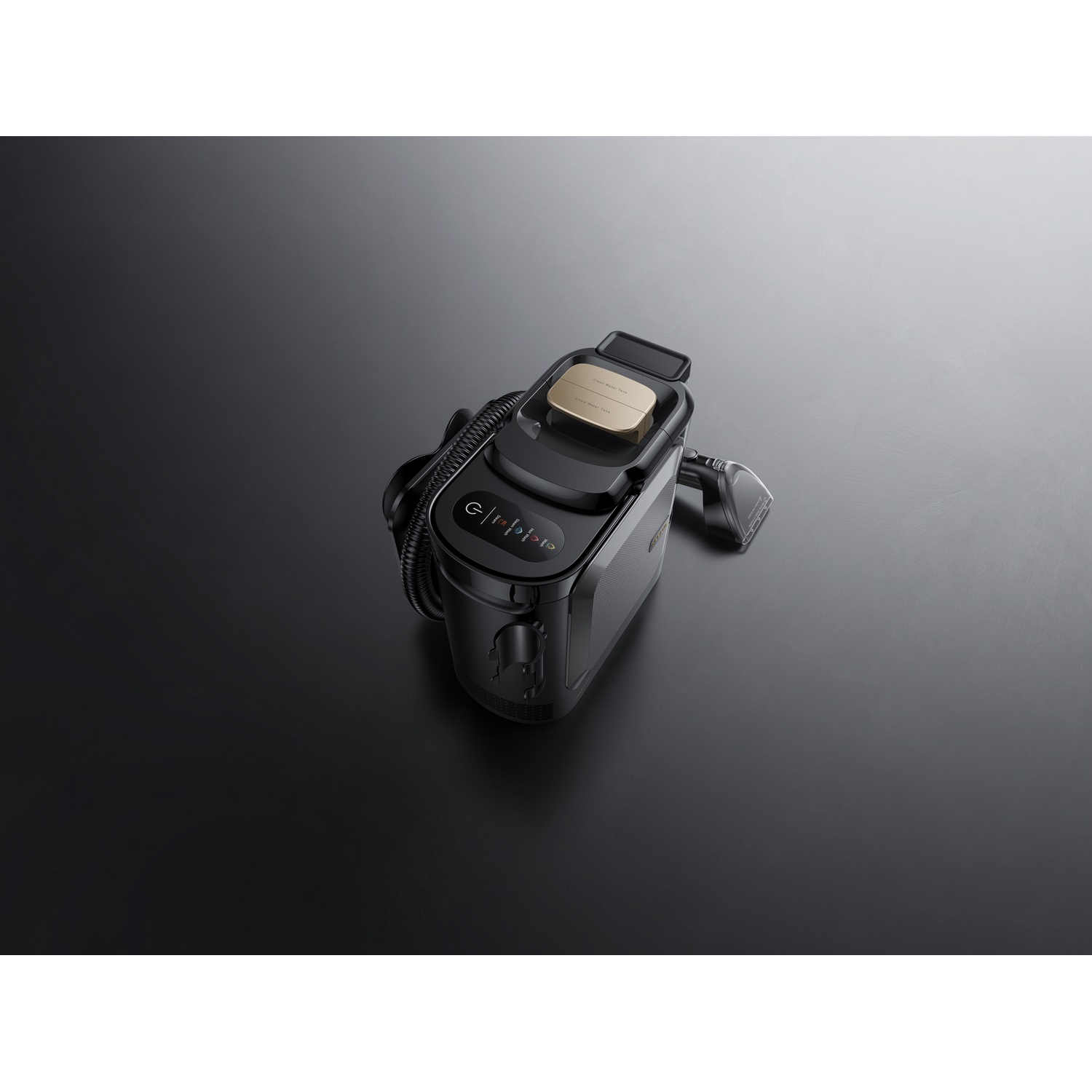 Black steam cleaner with attached nozzle and hose on a dark background.