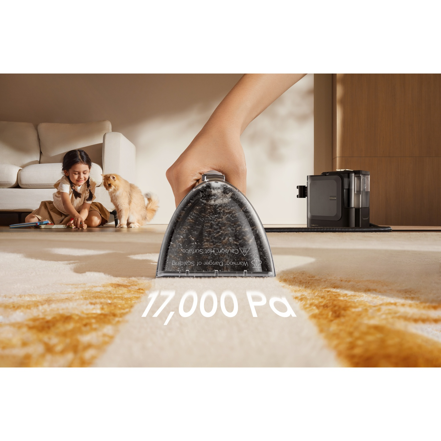 A hand uses a wet vacuum to clean a stain on a carpet, with a child and cat nearby.