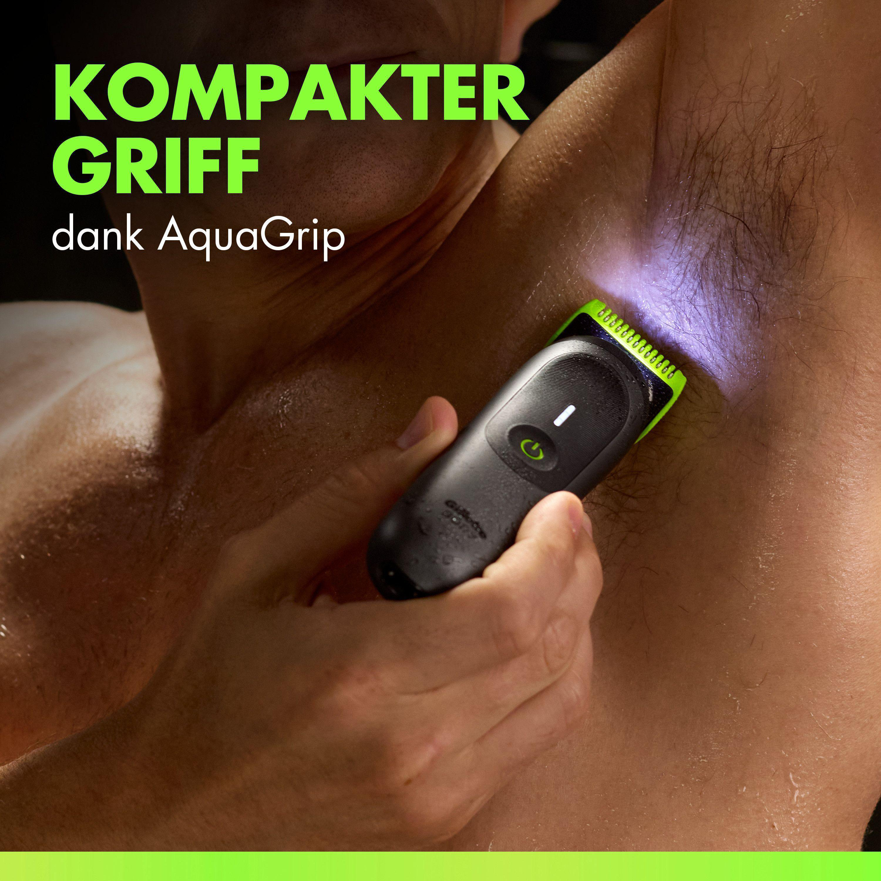 Ein Mann benutzt einen schwarzen Trimmer mit grünem Detail am Hals.
