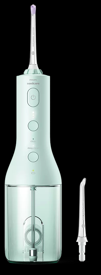Miętowy irygator Philips Sonicare z nasadką i osobną dyszą.