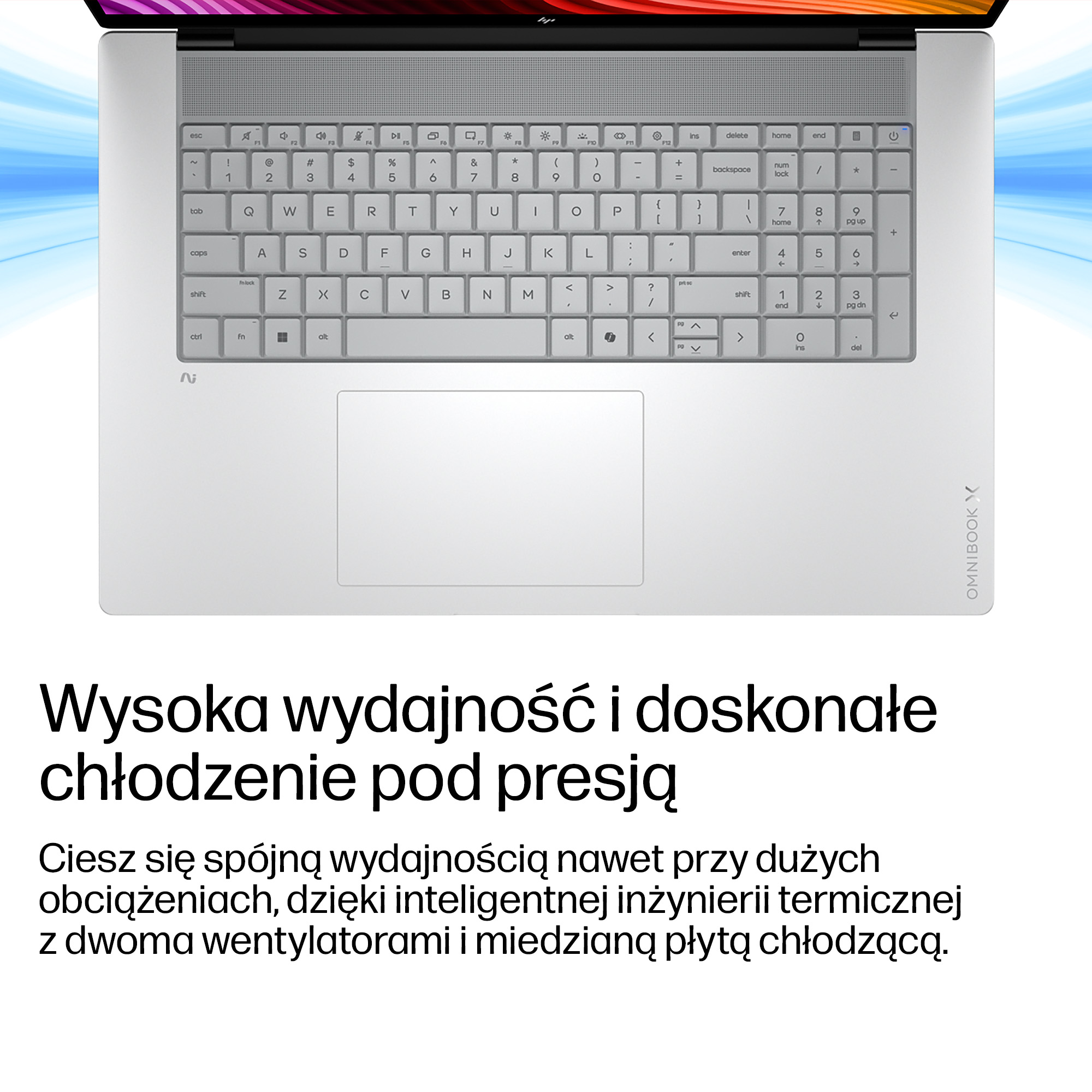 Szara klawiatura i touchpad laptopa z niebiesko-białymi liniami w tle.