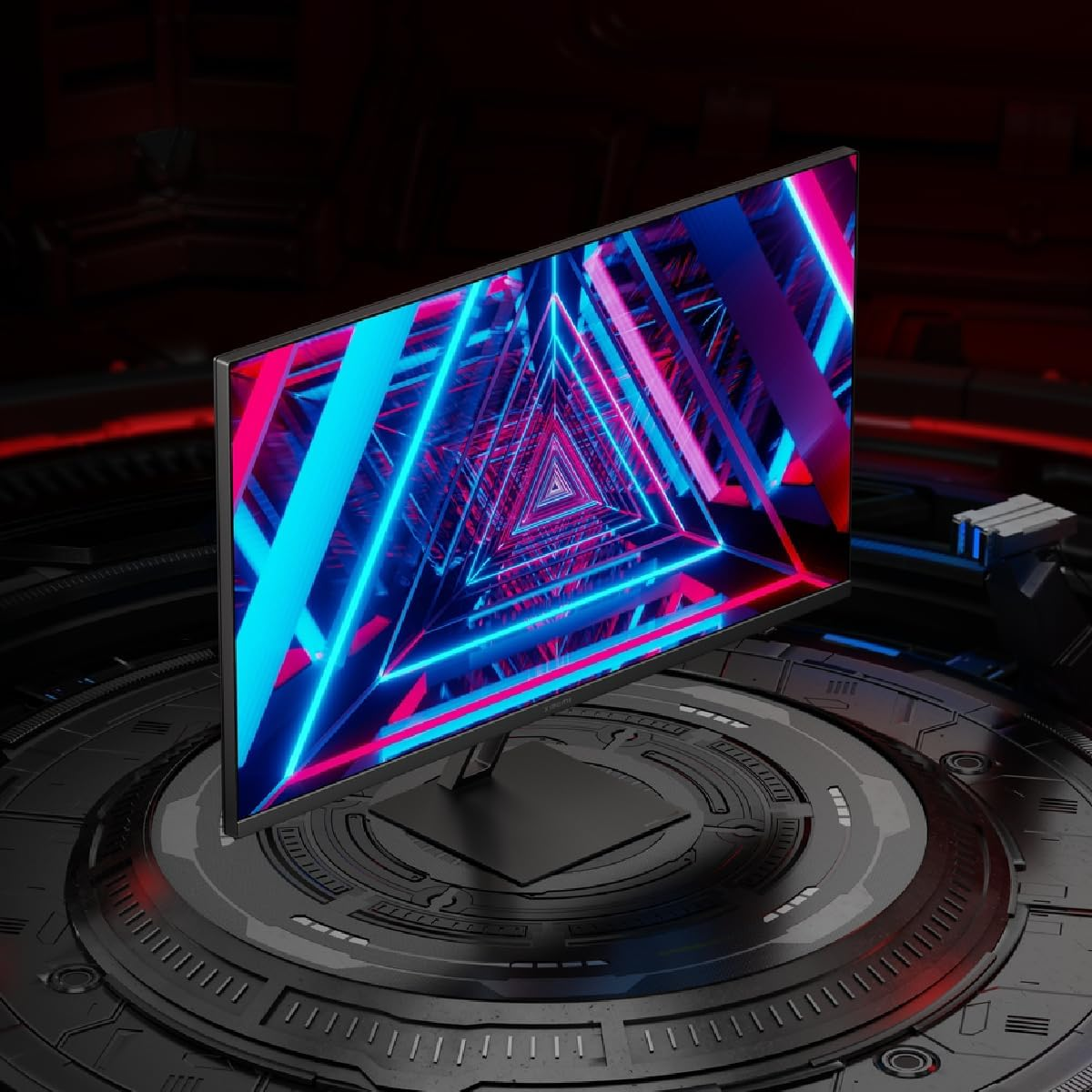 Un monitor que muestra un patrón de túnel de neón en azul y rosa sobre un fondo metálico oscuro.