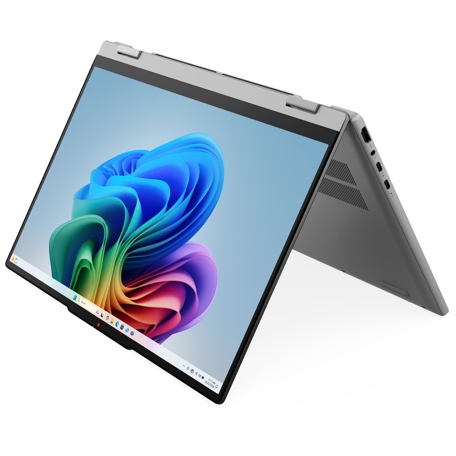 A silver laptop with its screen open, displaying a colorful abstract wallpaper.