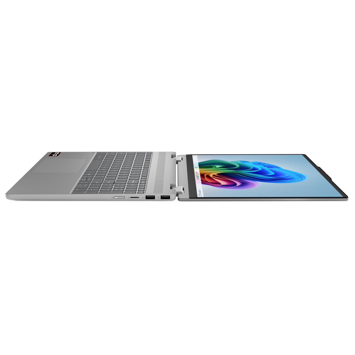 An open silver laptop displaying a colorful wallpaper on its screen.