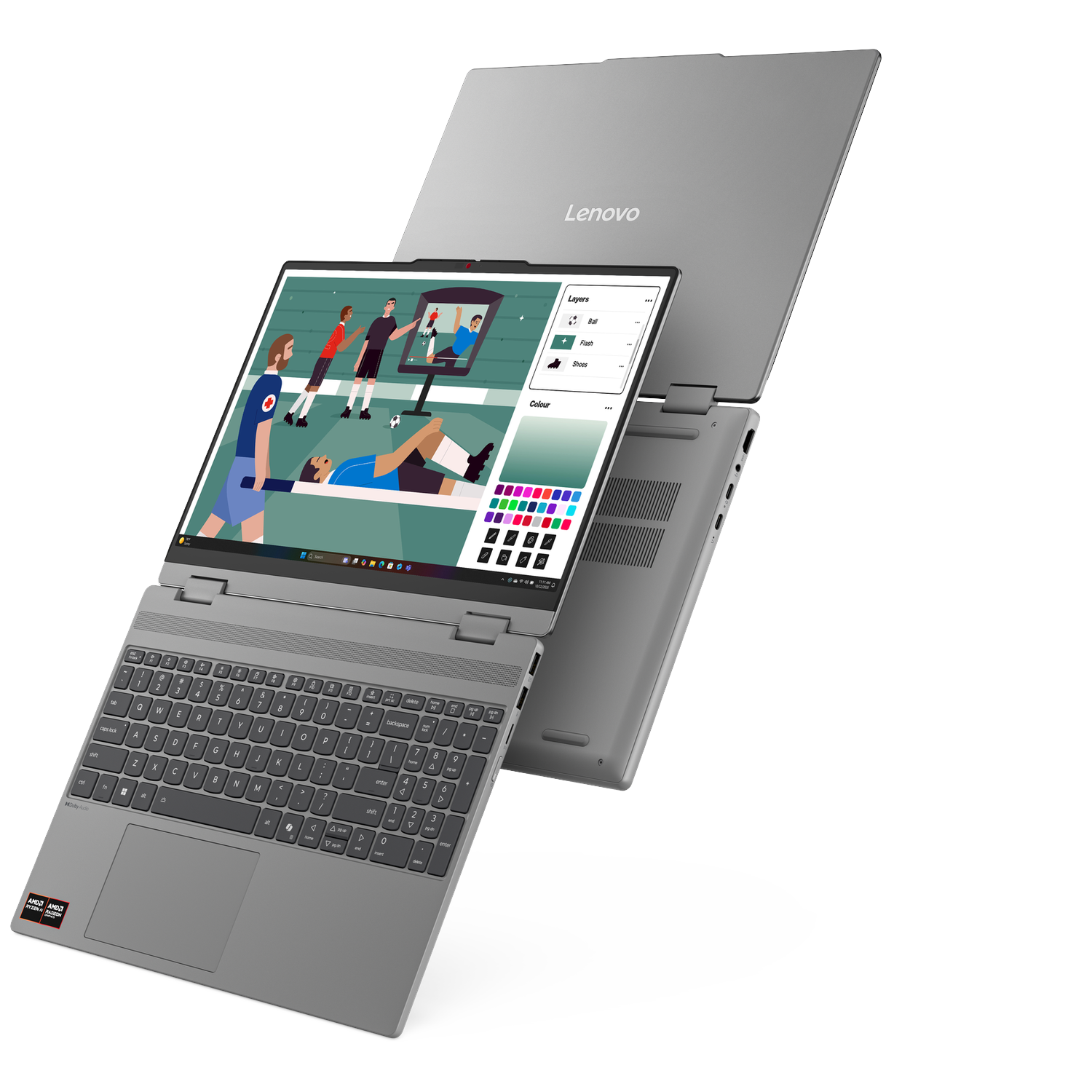 A silver Lenovo laptop displaying a soccer scene on a graphic design program.