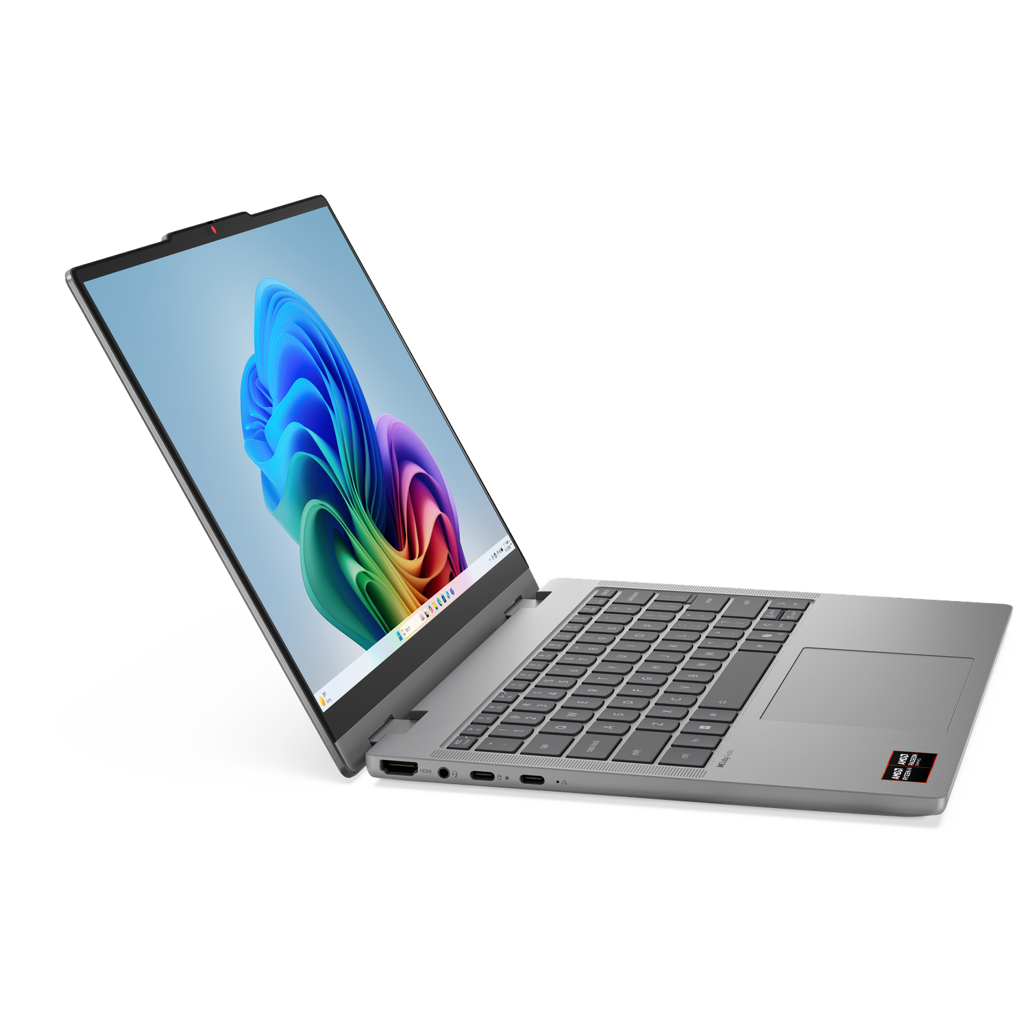 A silver laptop with its screen open, displaying a colorful abstract wallpaper. The keyboard and trackpad are visible.