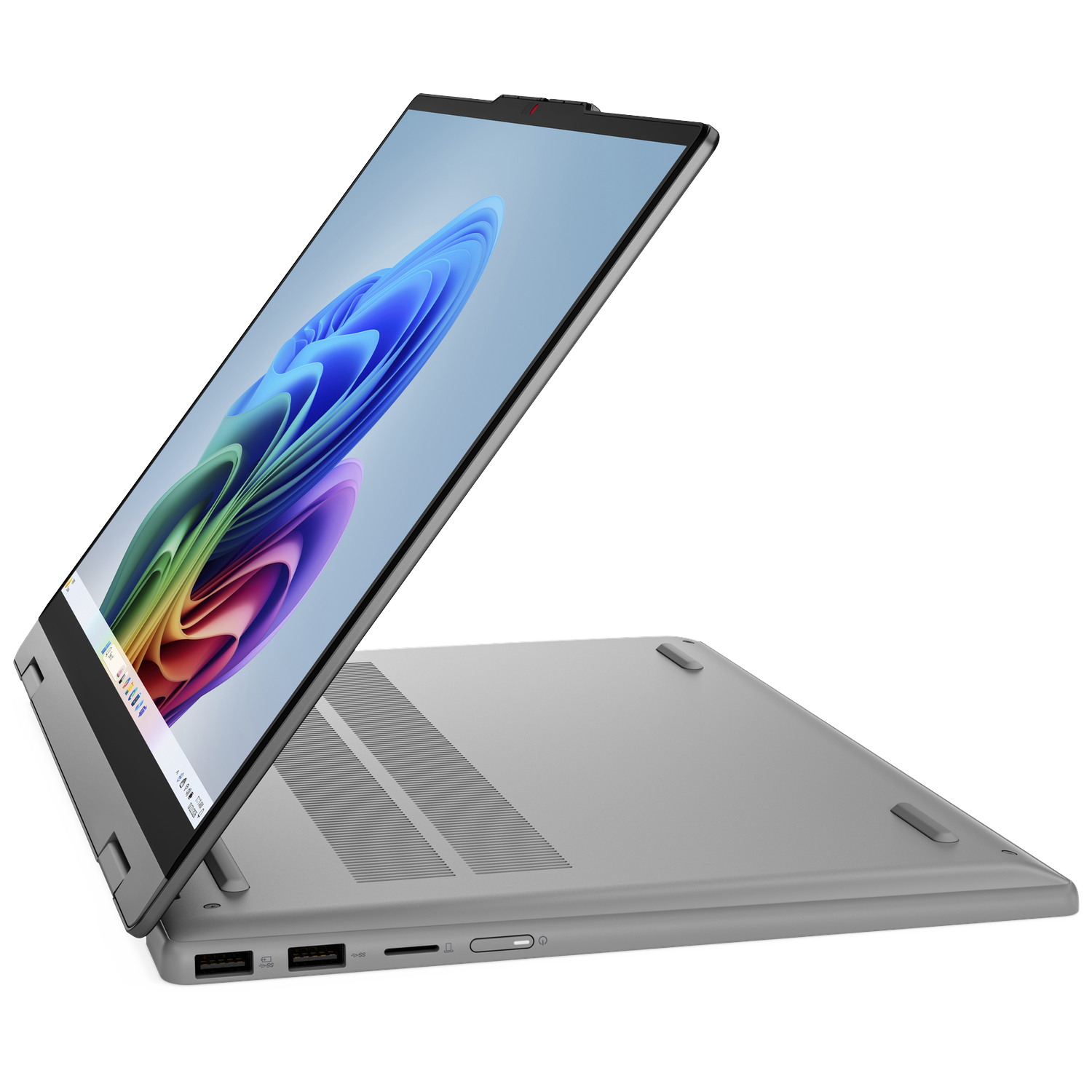 Silver laptop with screen open, showing colorful abstract wallpaper. Black background.