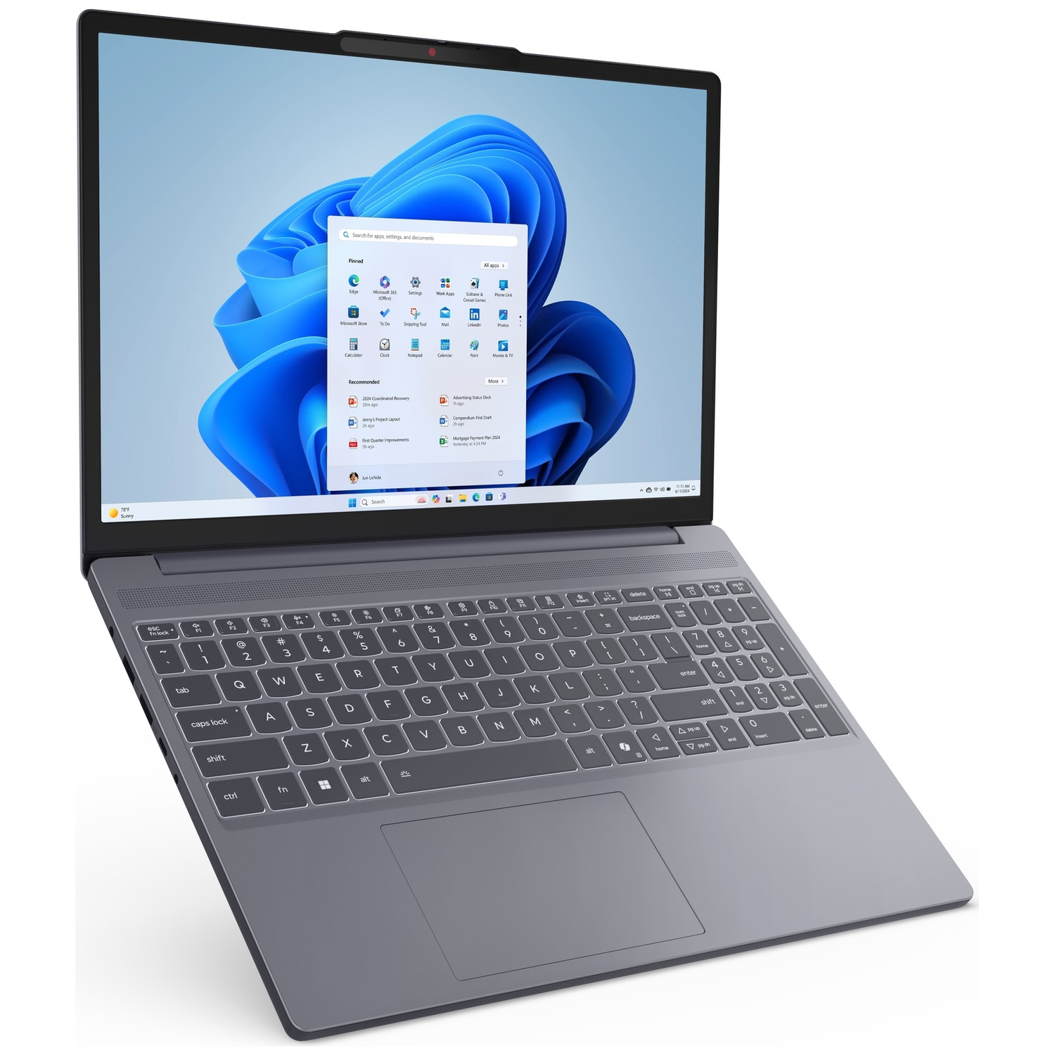 An open gray laptop displaying Windows 11 on screen.