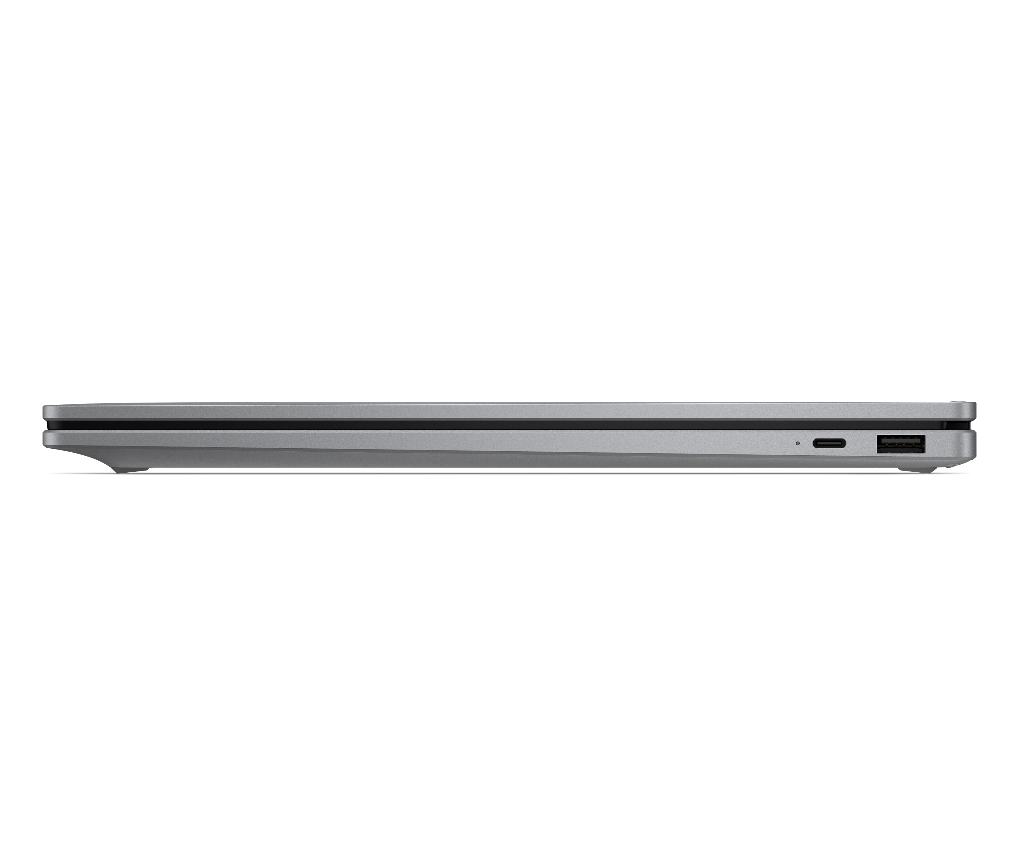 Srebrna krawędź laptopa z portami USB-C i USB-A na czarnym tle.