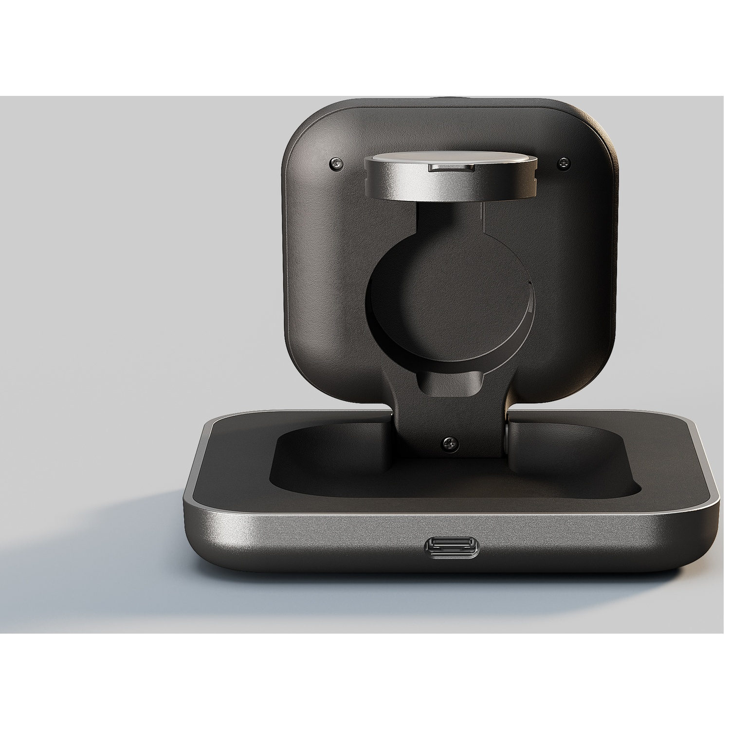 A black charging stand with a USB-C port and a silver ring.