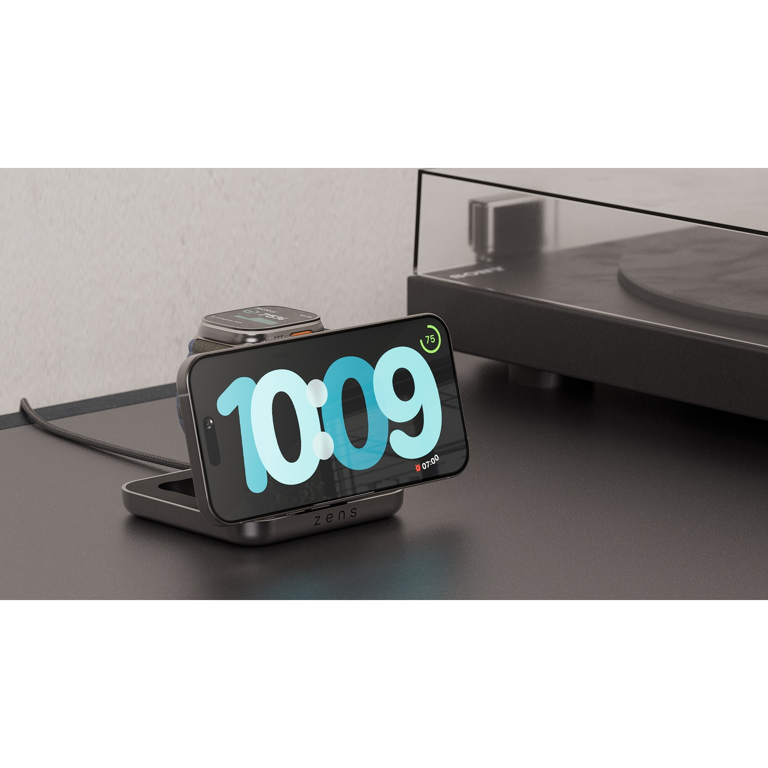 A black charging stand for iPhone and Apple Watch with music player.