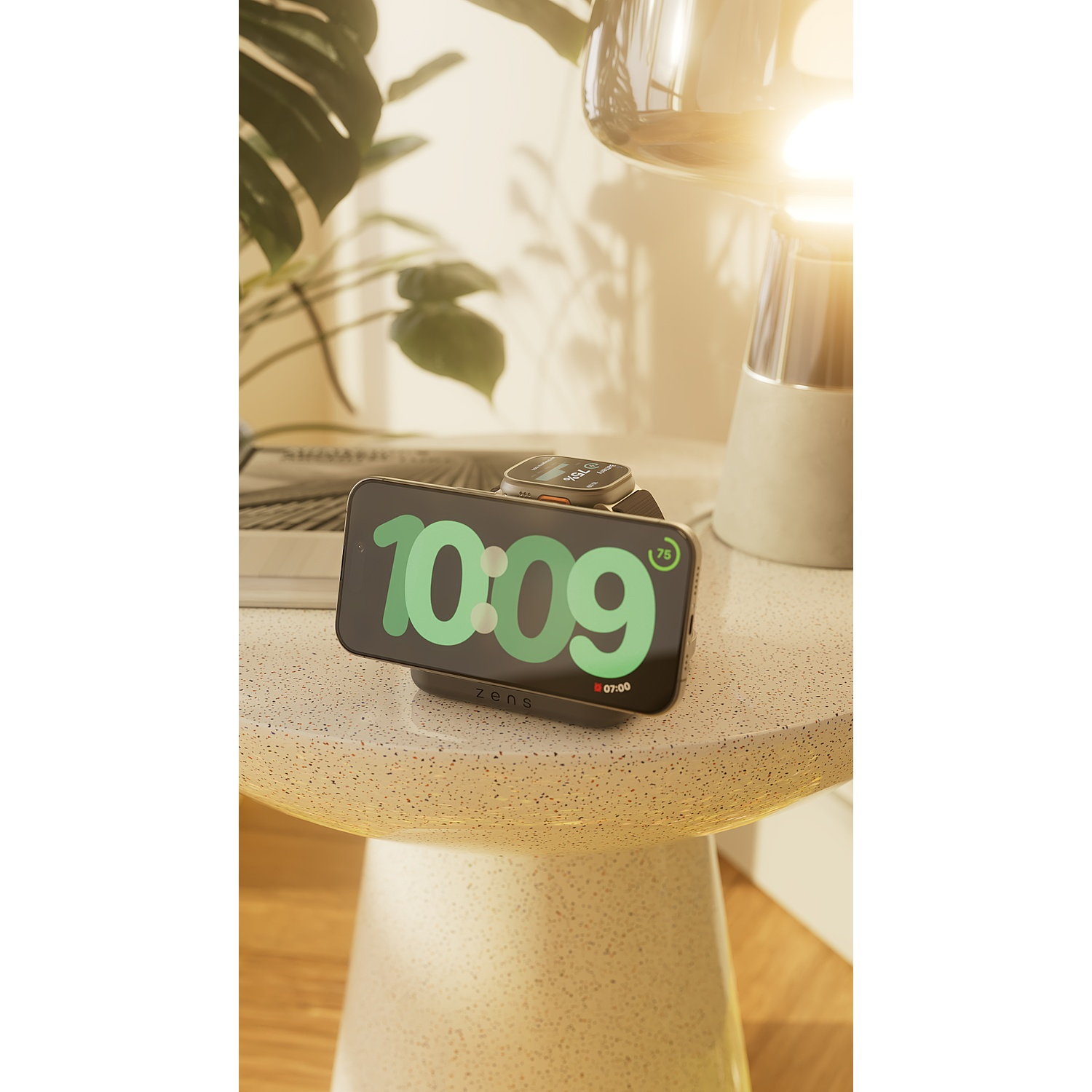 A smartphone and smartwatch display 10:09 on a textured table with a lamp and plant.