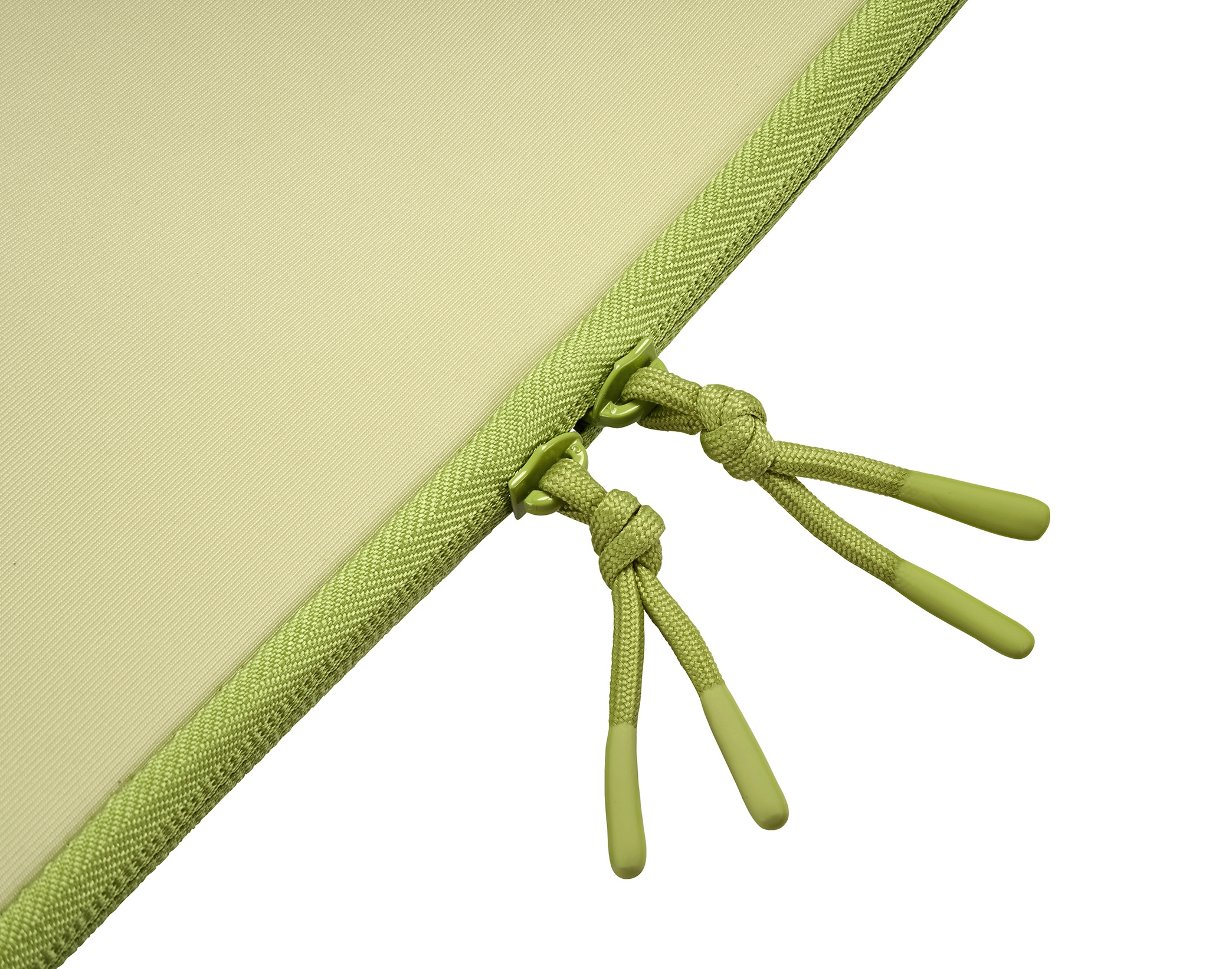 Tessuto verde chiaro con cerniera e cordoncini con punte verdi.