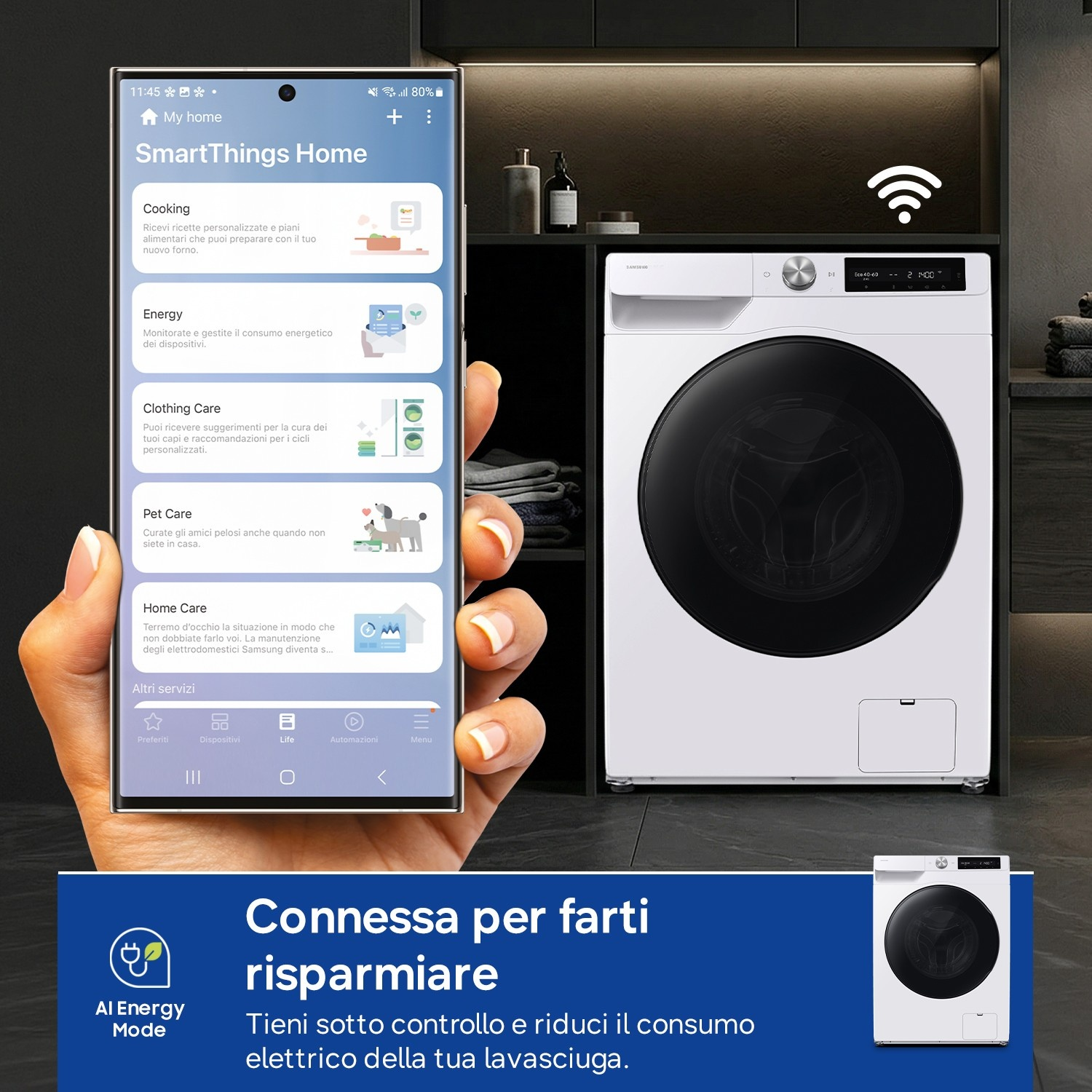 Un telefono mostra l'app SmartThings Home, accanto a una lavatrice.