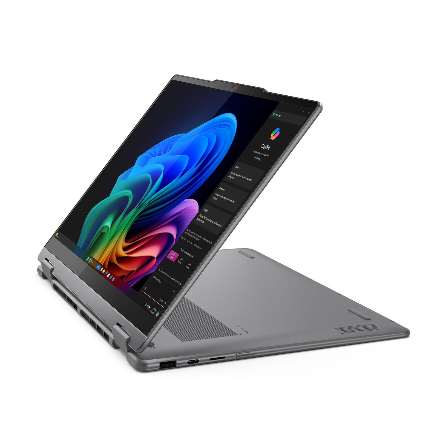 Un laptop convertibile grigio mostra uno sfondo astratto colorato sullo schermo, aperto ad angolo.