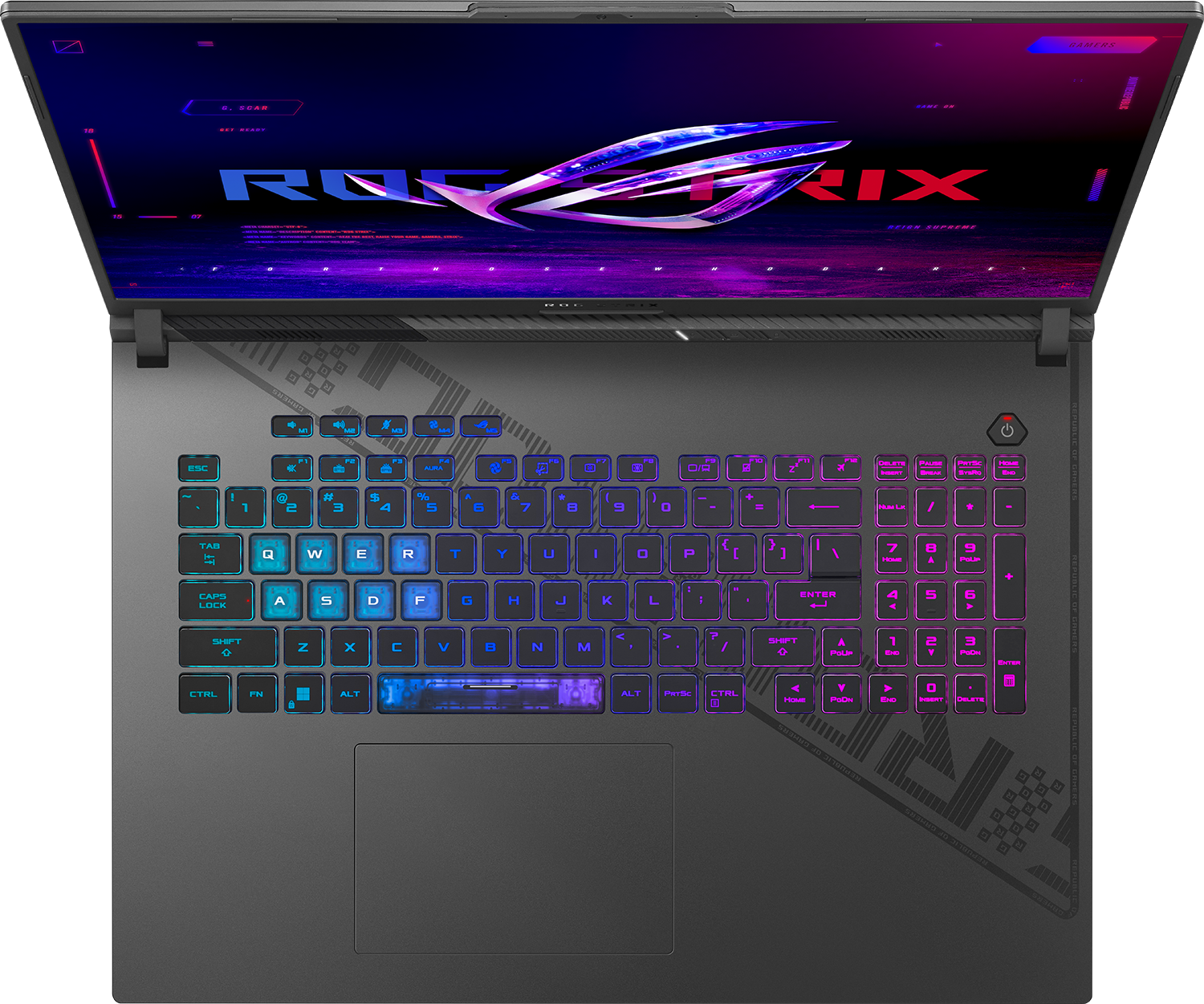 Nyitott gamer laptop világító billentyűzettel és csillogó logóval a képernyőn.