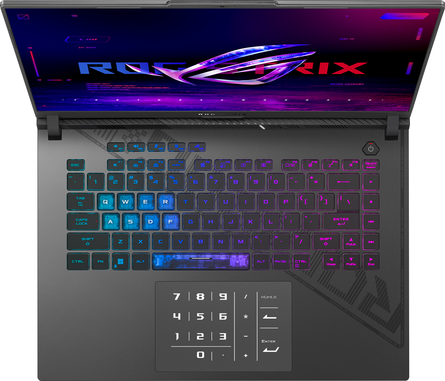 Egy nyitott laptop világító billentyűzettel és csillogó ROG logóval a képernyőn.