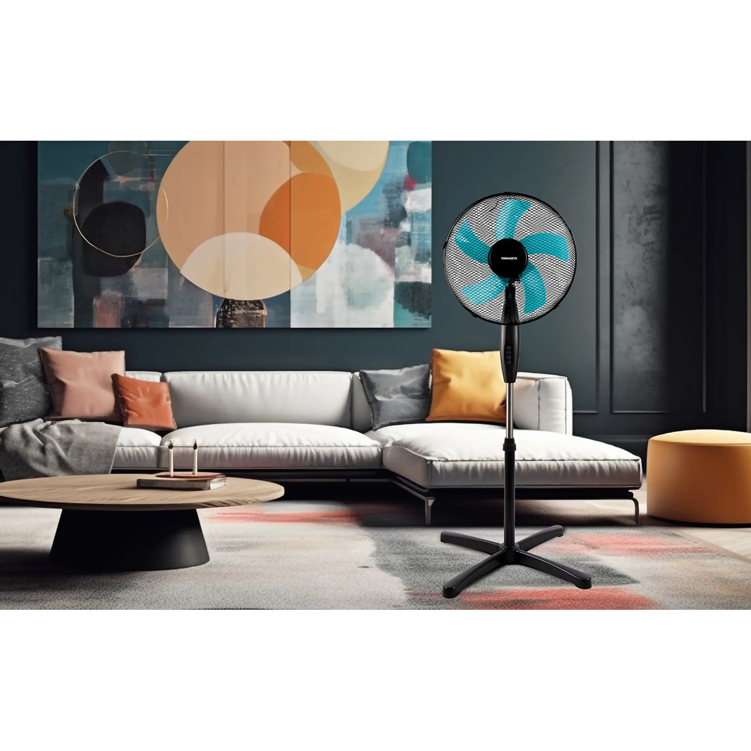 A standing fan with blue blades is in a modern living room.