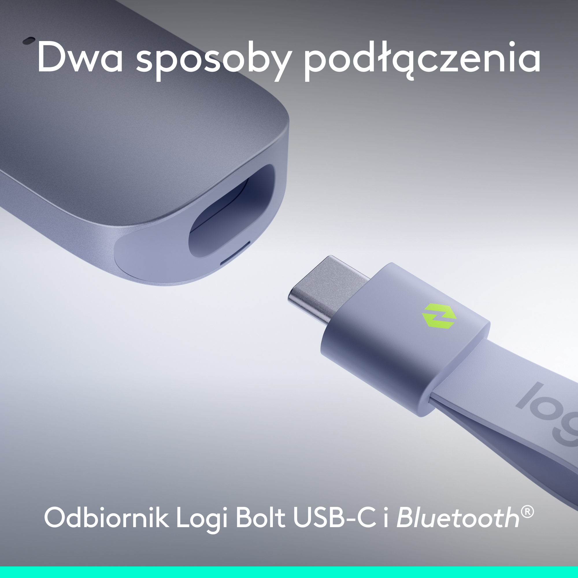 Szary klucz USB-C z zielonym logo jest wkładany do urządzenia.