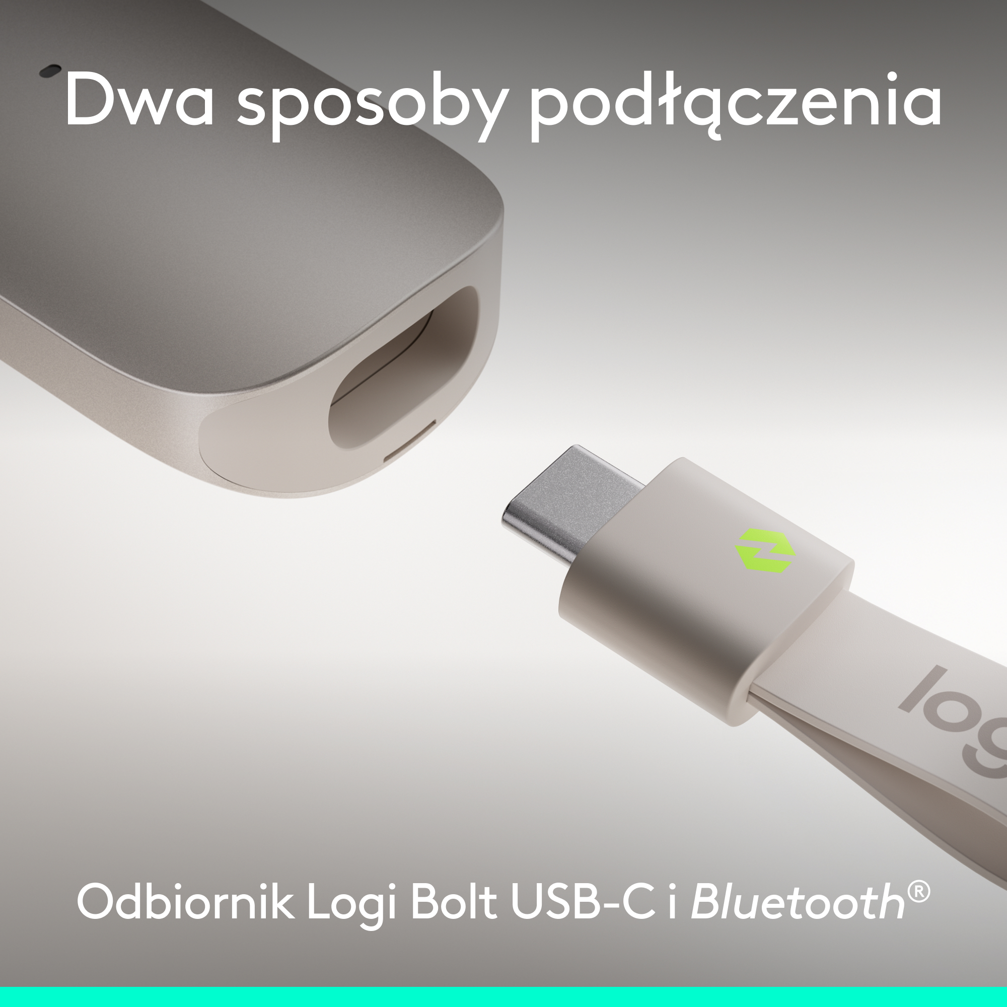 Srebrny klucz USB-C z zielonym logo zbliża się do odbiornika.