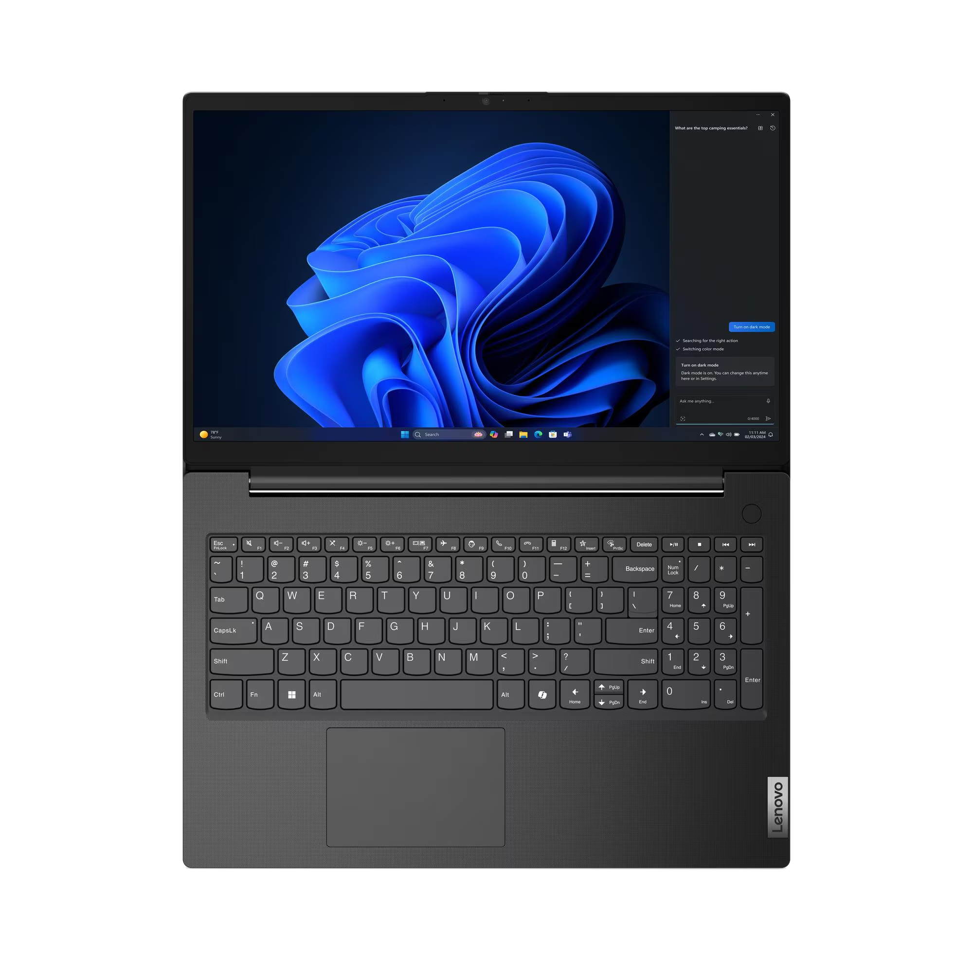 Un portátil abierto con fondo oscuro y teclado.