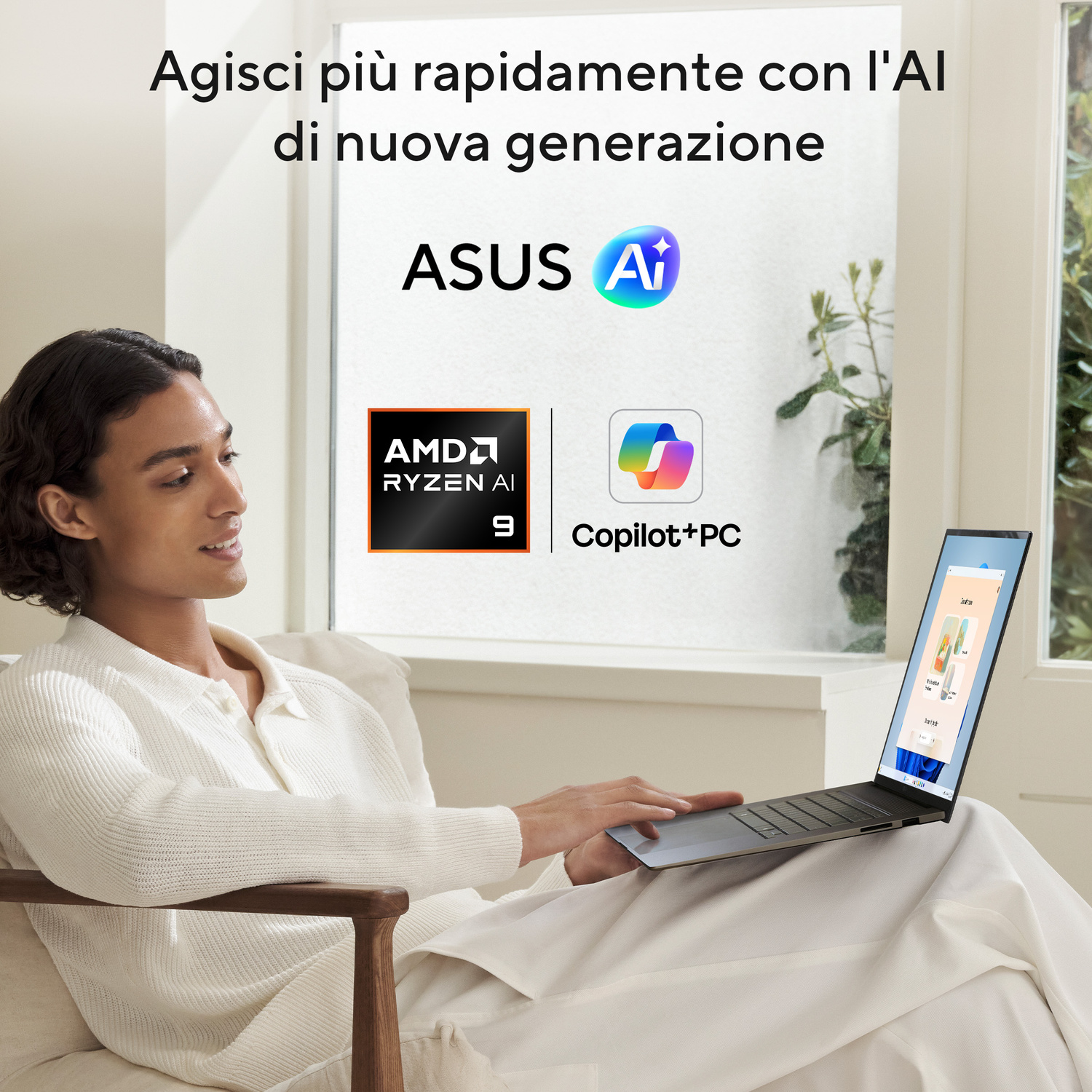 Uomo con laptop seduto in poltrona, ASUS AI, AMD Ryzen AI 9, Copilot+PC.